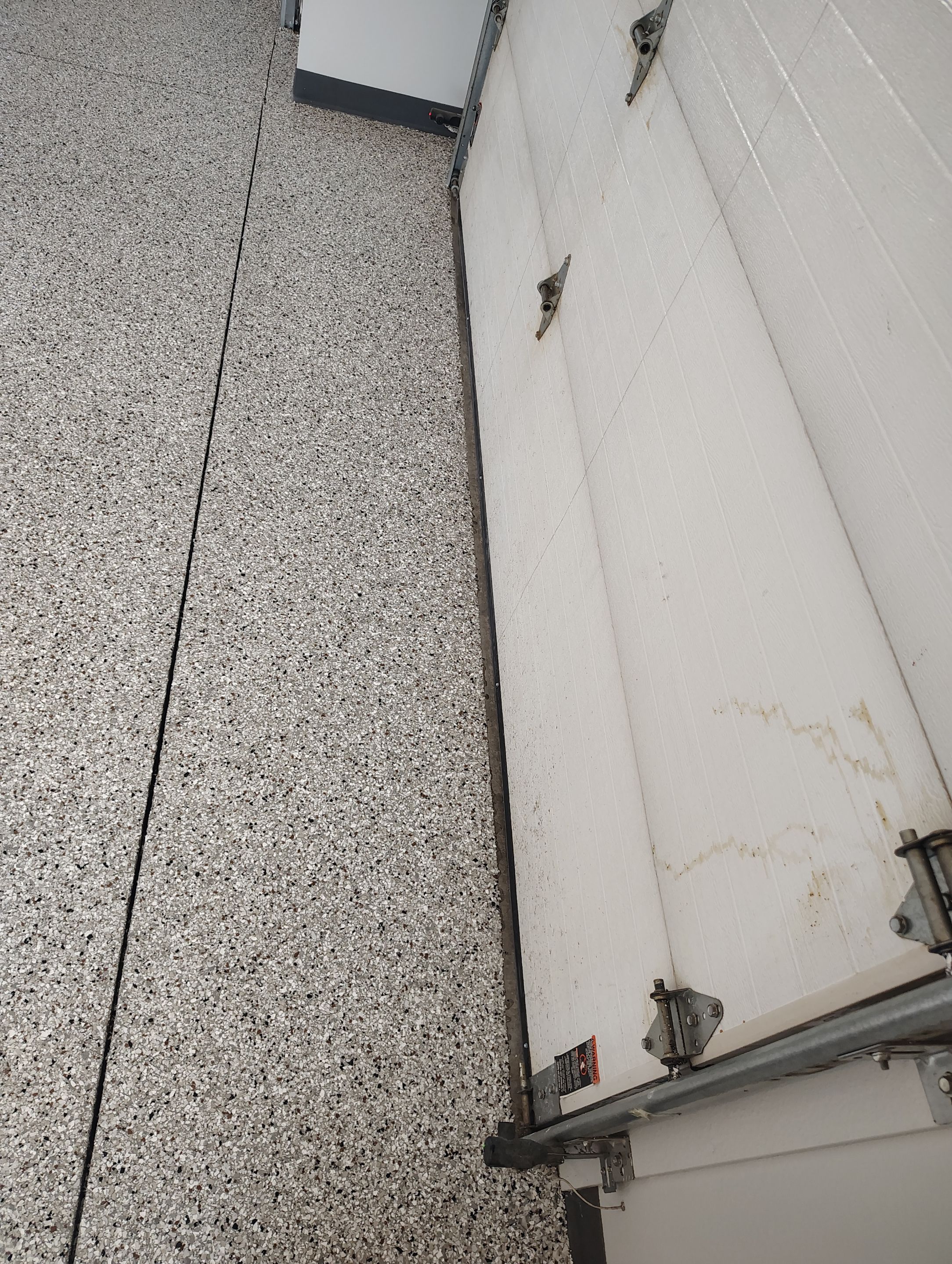 Multi-Car Garage Concrete Coating and Crack Repair in Dell Rapids by Select Painting, Coatings & Garage Cabinets