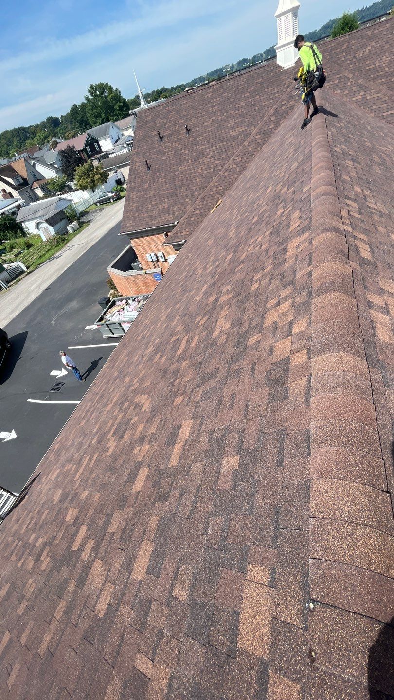 Commercial Roofing Installation using Performance Shingles by Mr. Roofer