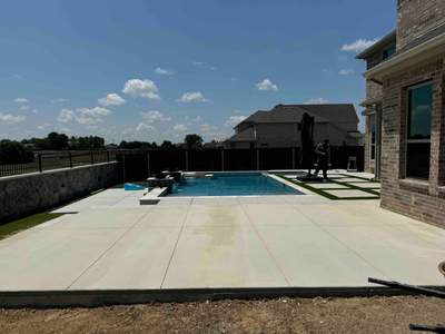 Geometric Pool with Tanning Ledge and Turf Accents