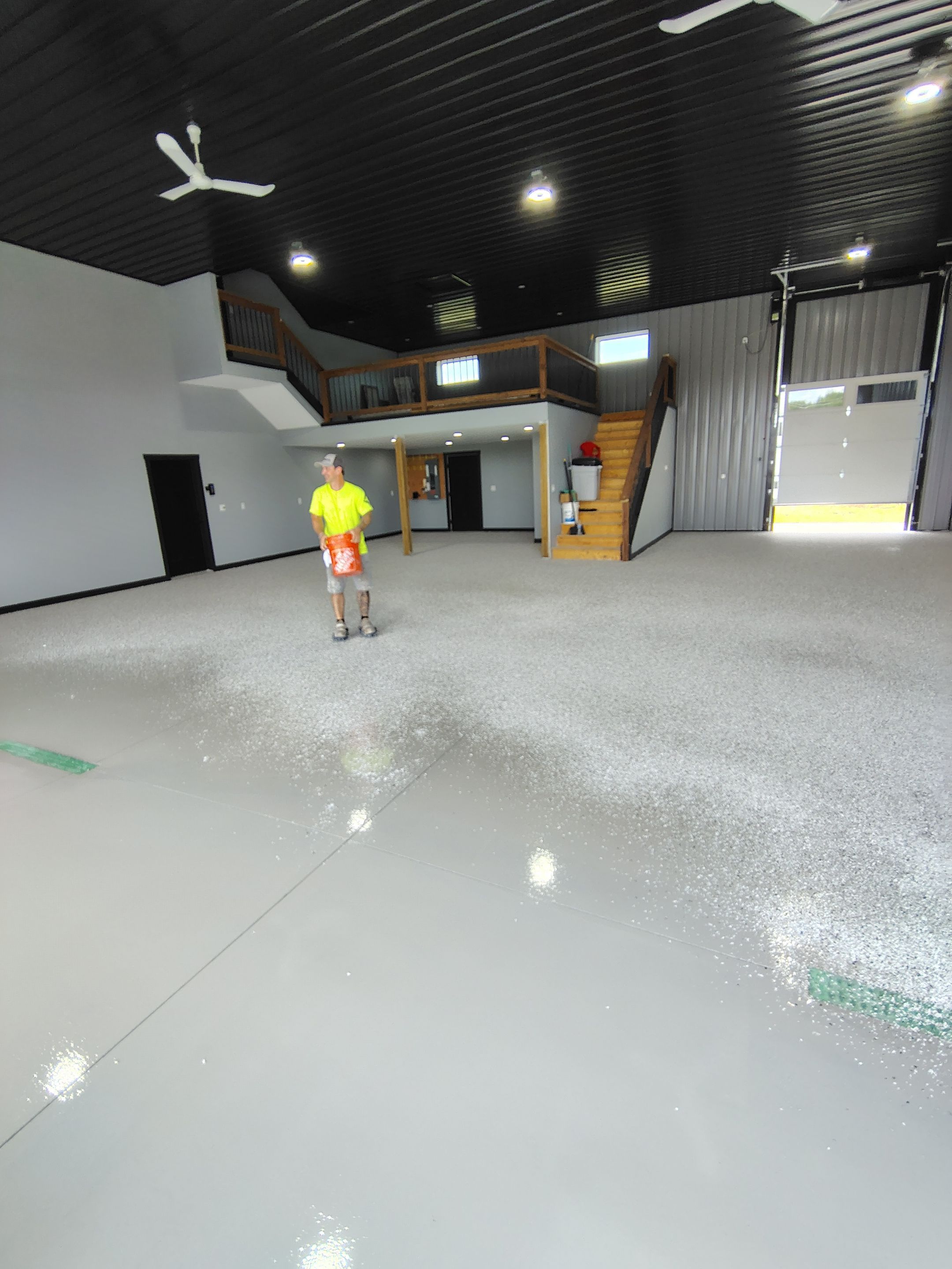 Polyaspartic Garage Floor Coating with Decorative Flake in Wentworth by Select Painting, Coatings & Garage Cabinets