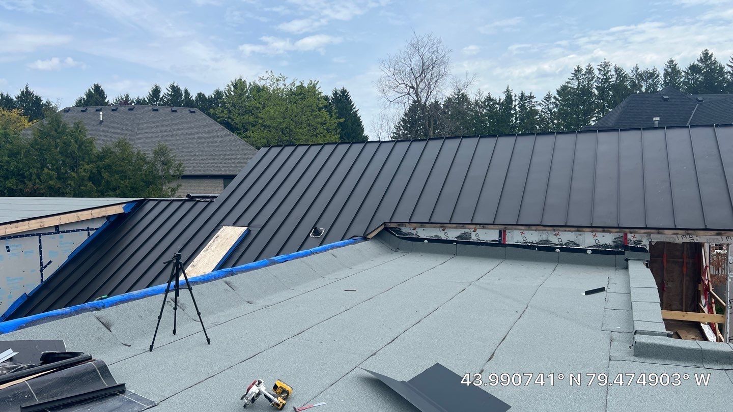 Custom Home Jet Black 24 GA Standing Seam Roof  by Jay Carter Roofing & Sheet Metal