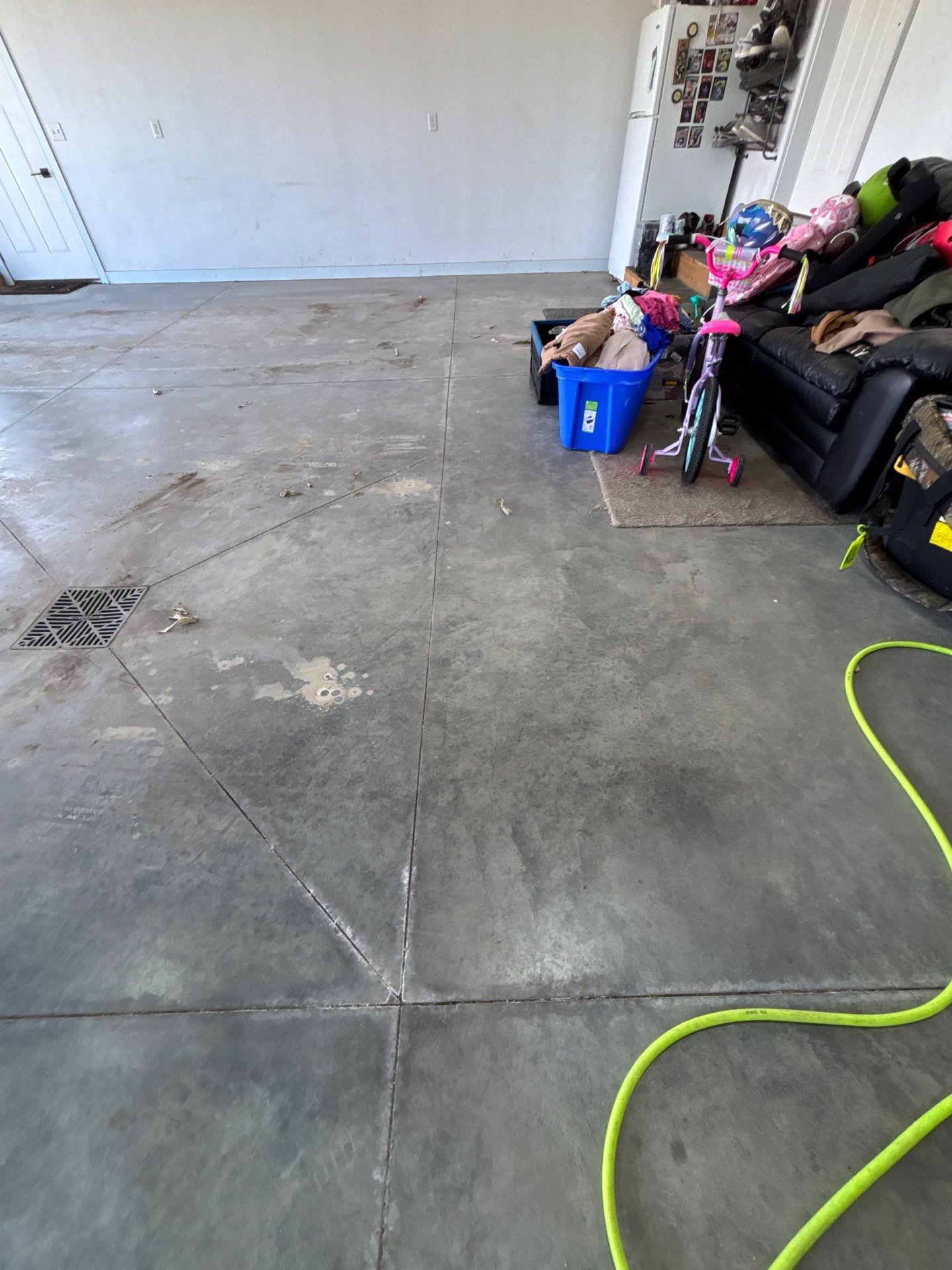 Speckled Polyaspartic Garage Floor Coating Installation in Dell Rapids by Select Painting, Coatings & Garage Cabinets