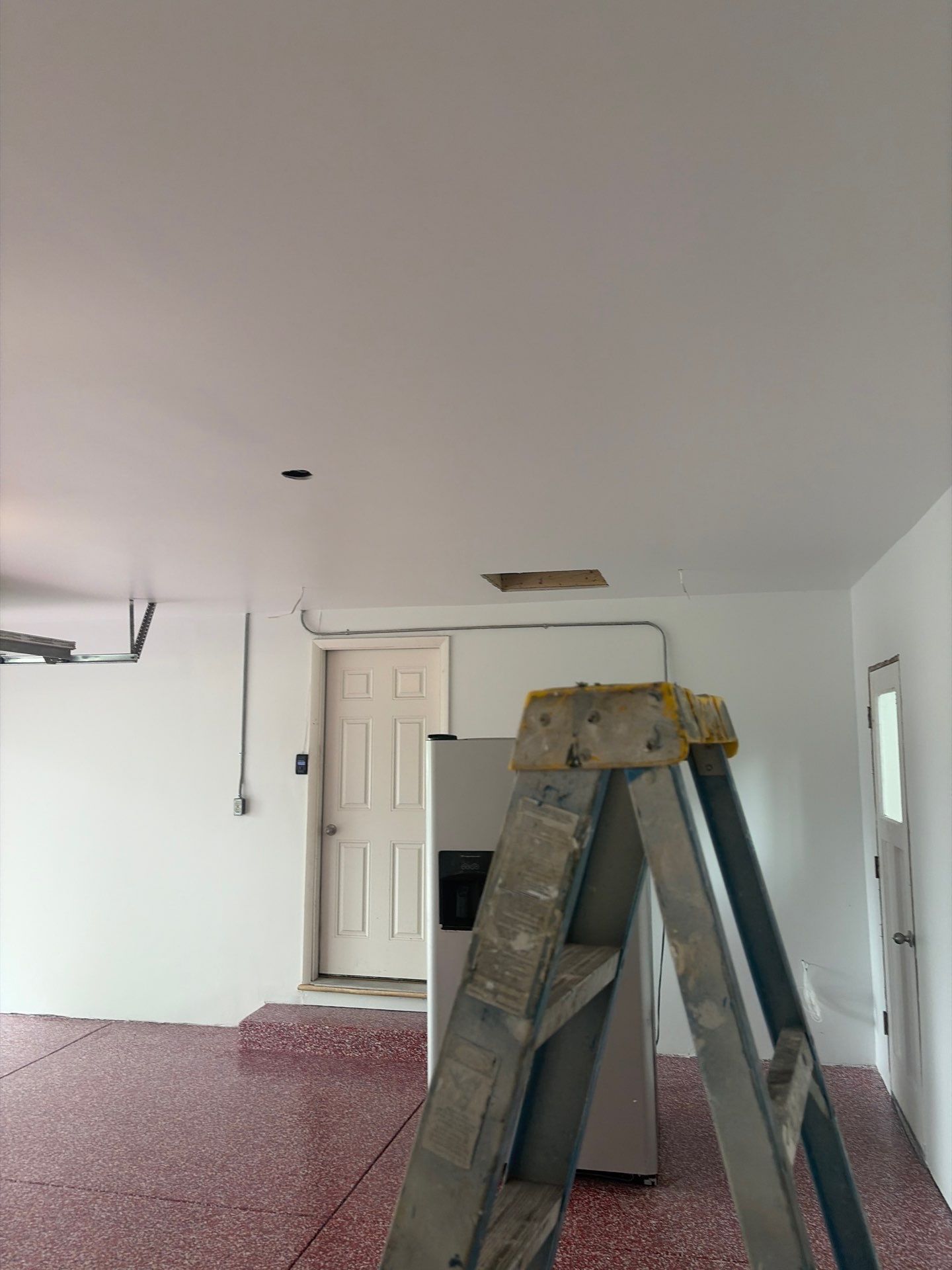 Bayside Garage Interior Remodel with Custom Epoxy Floor Coating by OCS Contracting Services