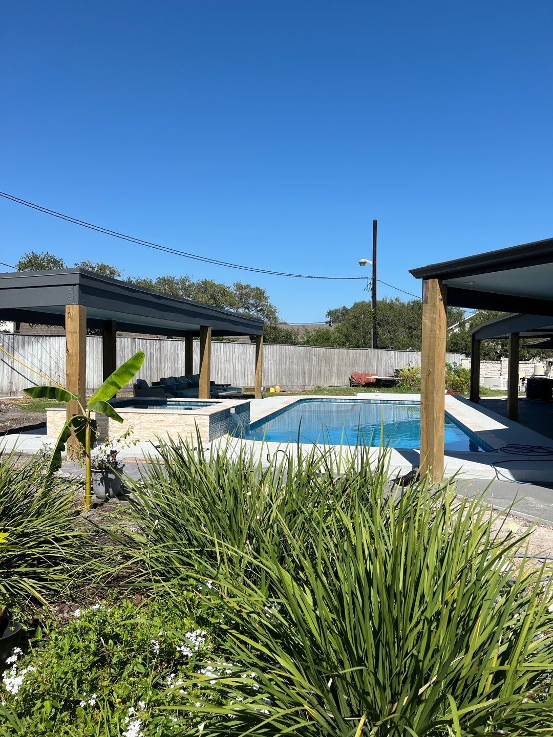Beautiful pool side build by Bayfront Roofing and Construction