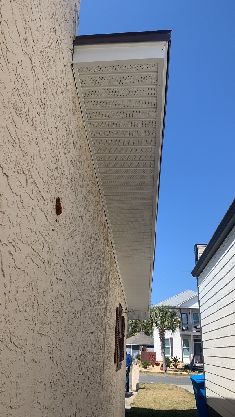 Soffit and Fascia Installation Using White Vinyl Soffit and Musket Brown Fascia by Gutter Professors