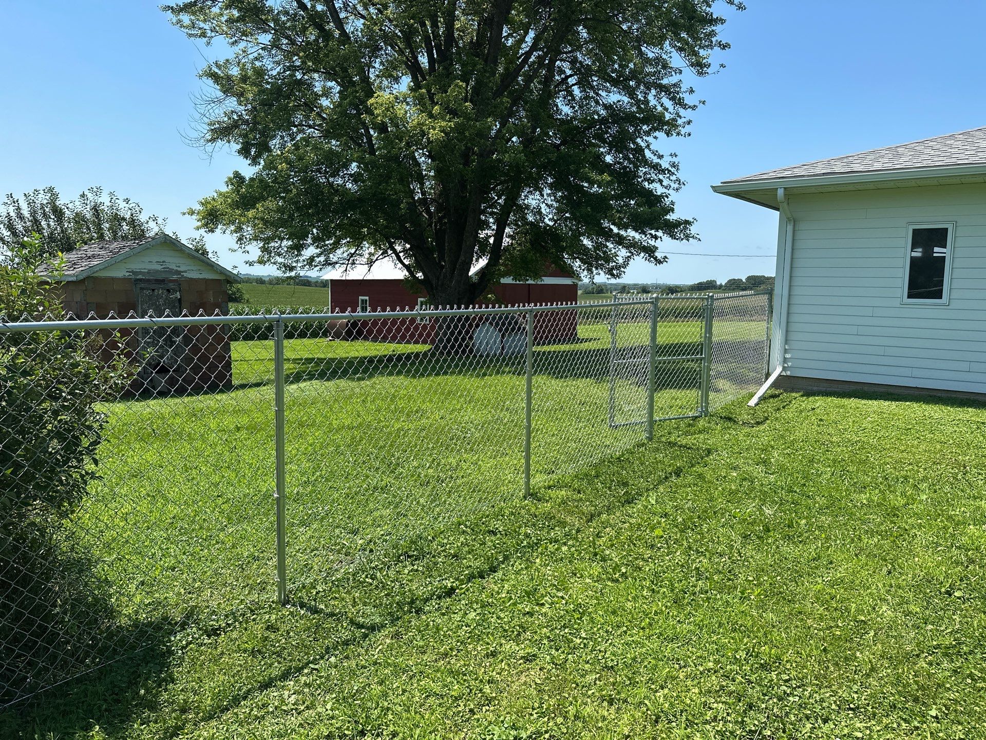 Residential Galvanized Chain Link Perimeter Fence Installation in New Hartford by Perfect Picket Fence and Stain