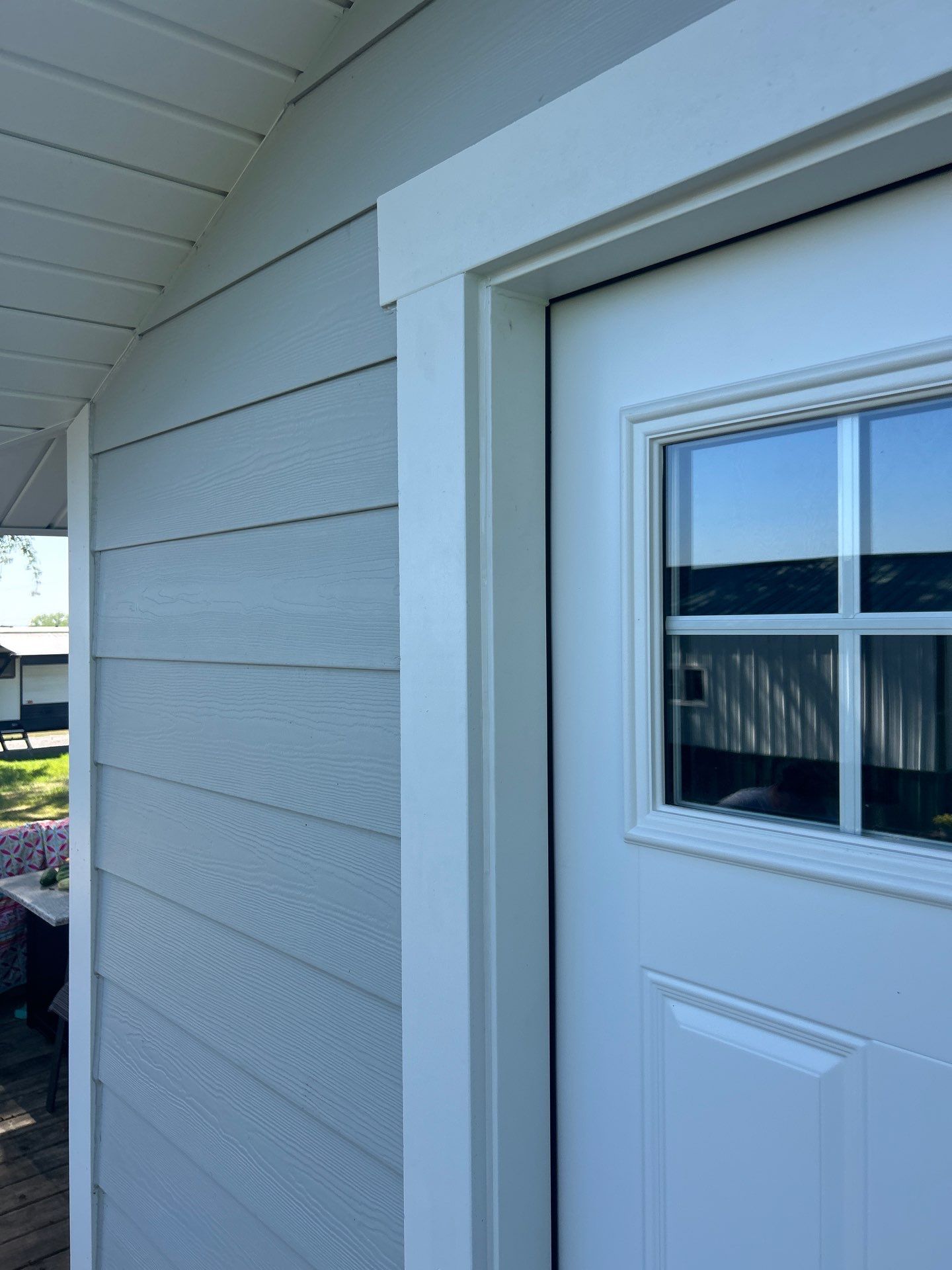 Light Mist Siding and Exterior Door Installation in Sidney by Carps Complete Exteriors