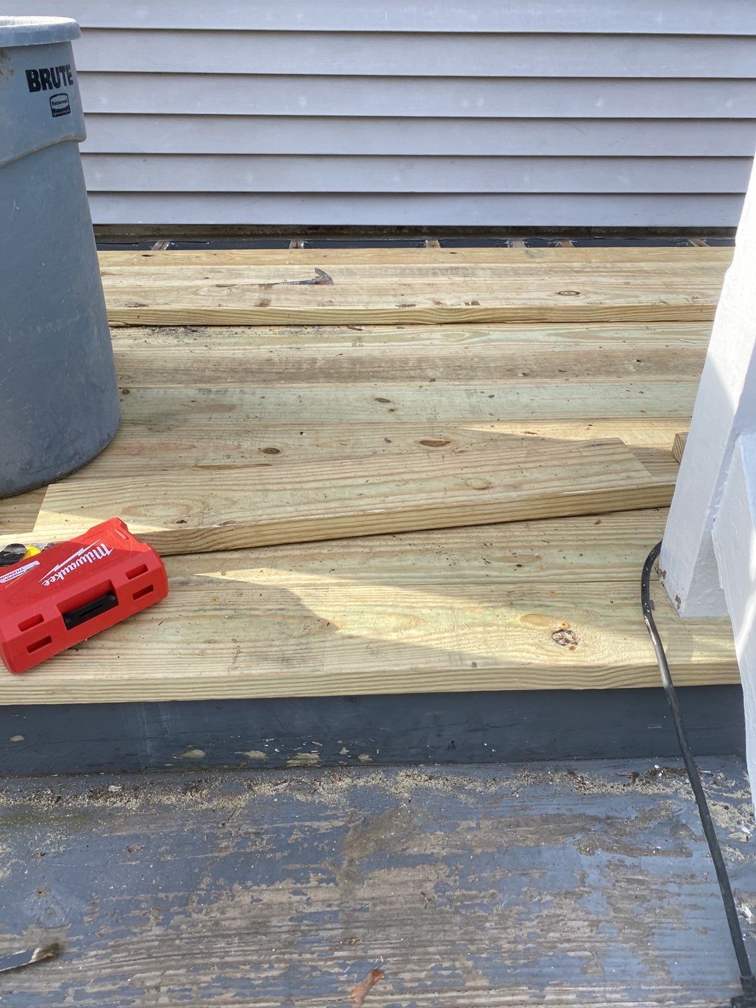 Deck Installation using Pressure treated railing by A Plus Exterior