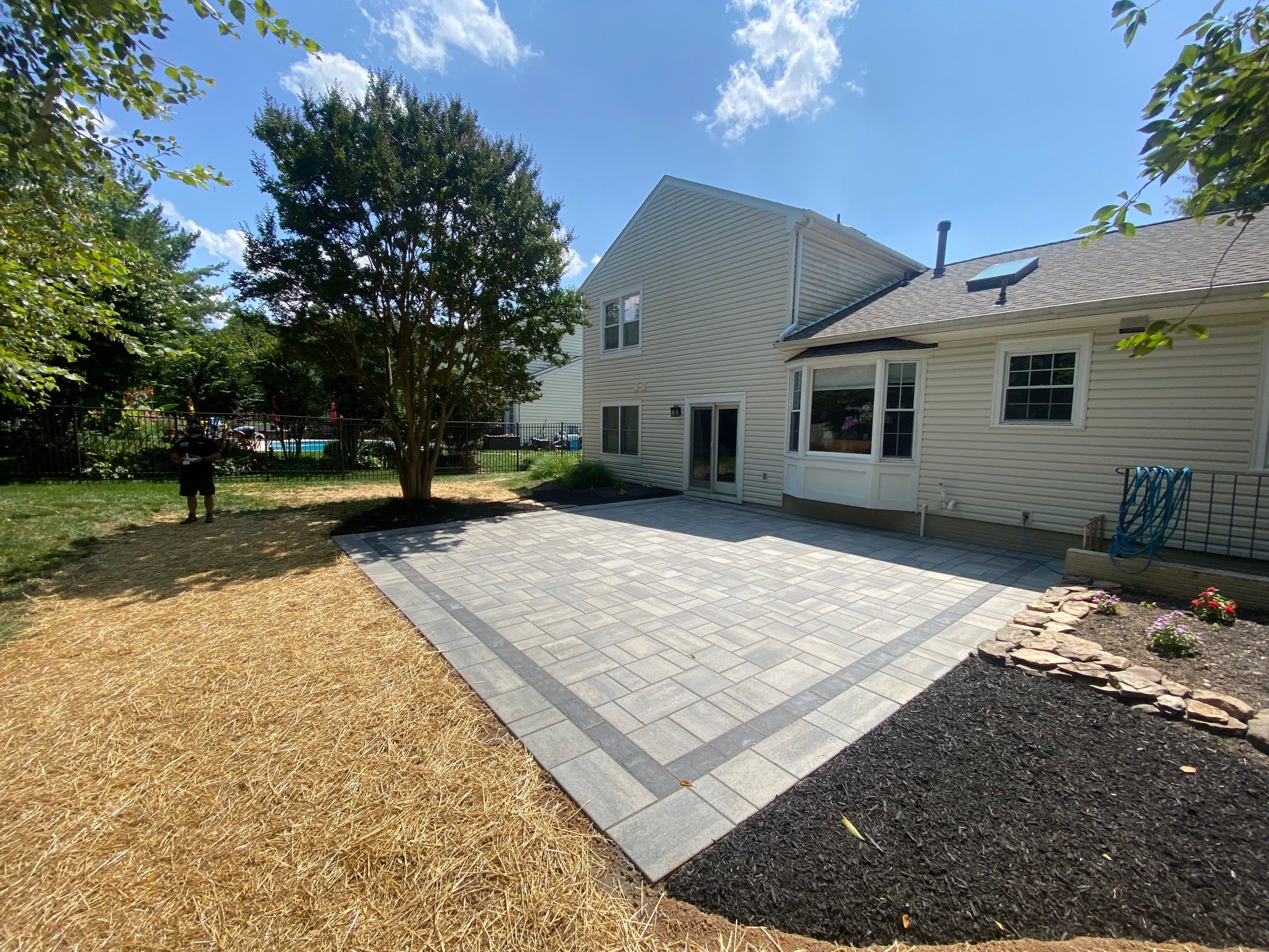 Backyard Transformation using Techo-Bloc Pavers by The Smet Companies, LLC