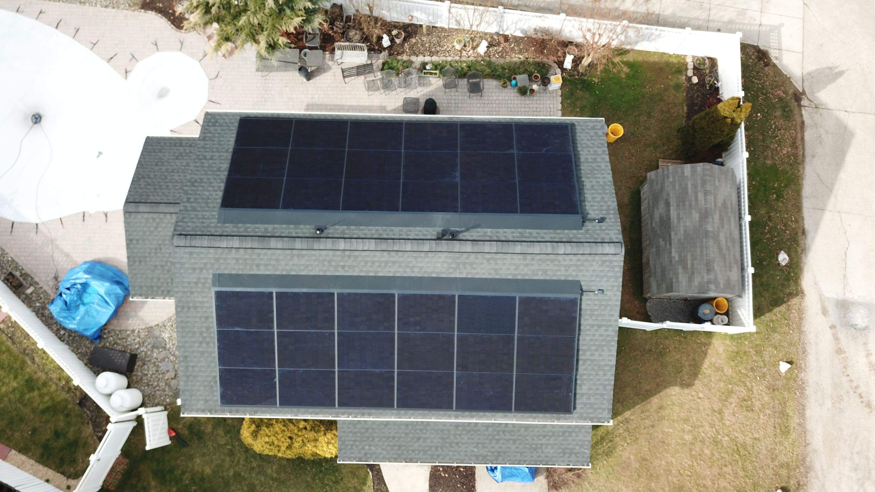 Roof Replacement with GAF Decotech integrated solar panels by American Home Contractors