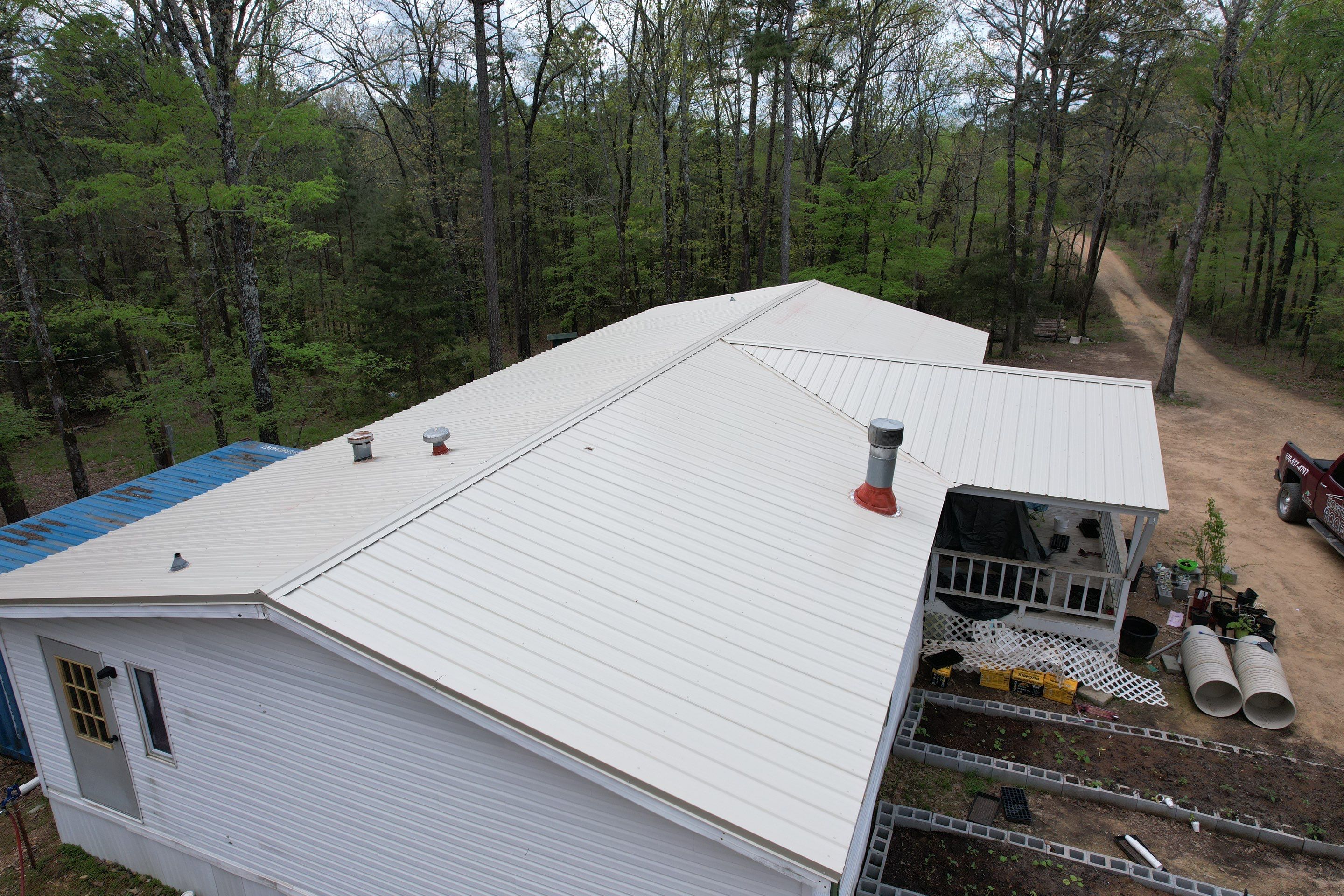 Residential Roofing Installation using 26 Gauge Colored Panels by Hostetler Roofing