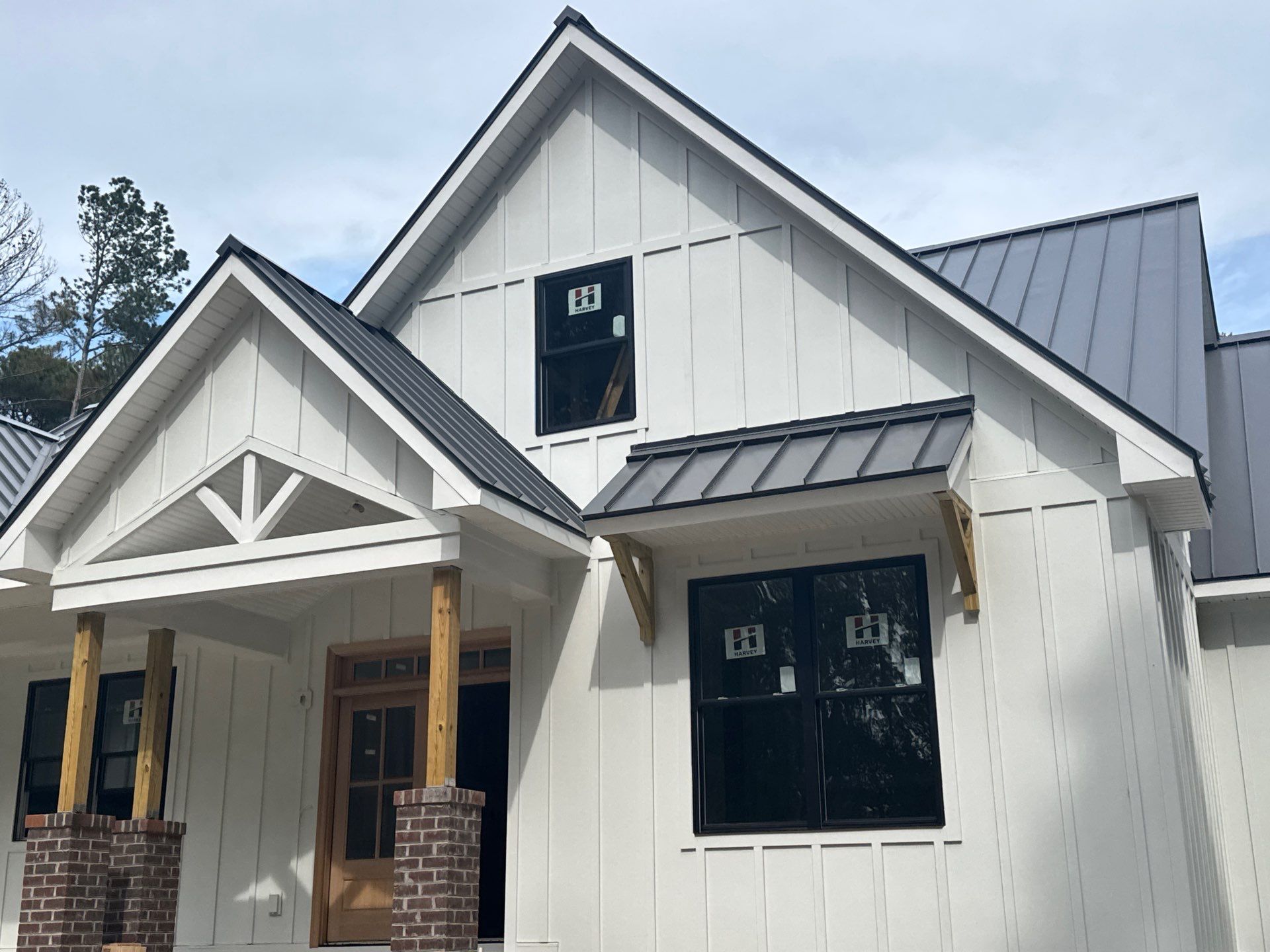 Custom New Construction Home Featuring Standing Seam Metal Roofing in Port Haywood by Cade Construction