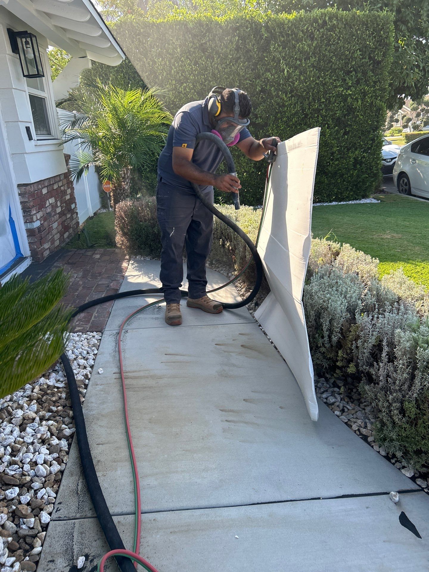 Sandblasting Paint Off Concrete Driveway In Downey, CA by La Power Washing Inc