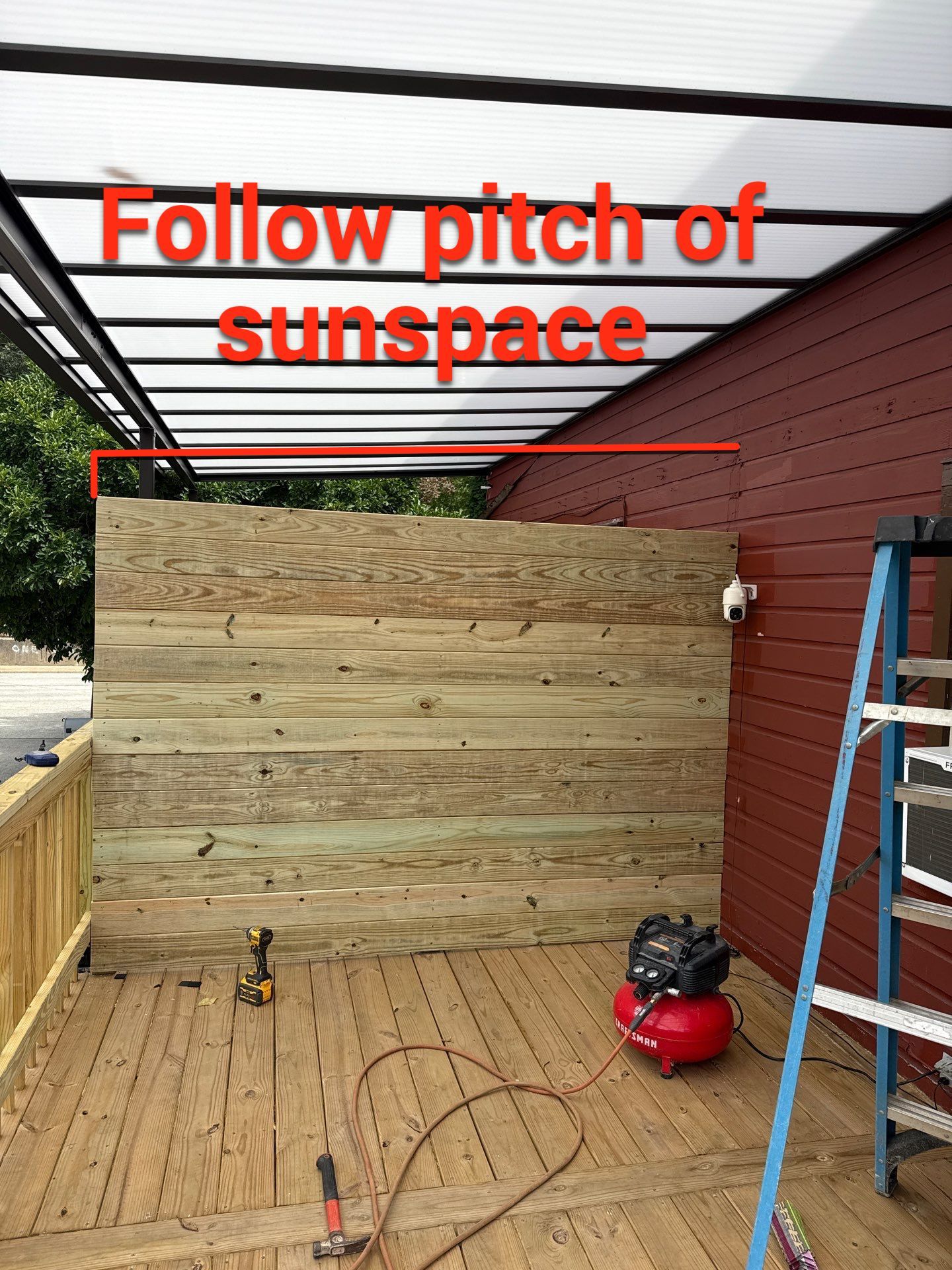 Roof sunspace deck  by Cousins Roofing Siding & Decks