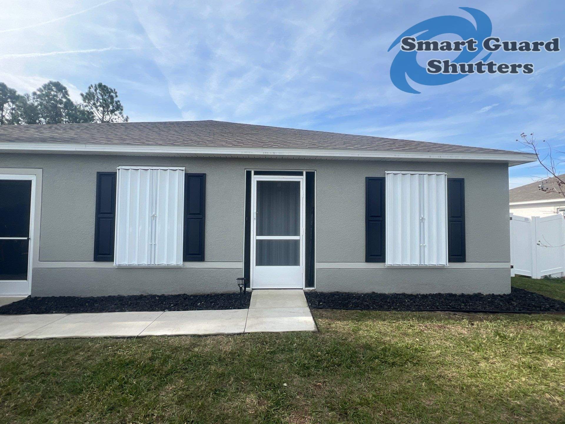 Accordion Shutters in White by Smart Guard Shutters