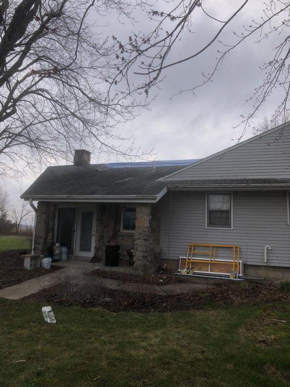 Storm damage roof replacement by Nitro Roofing and Construction