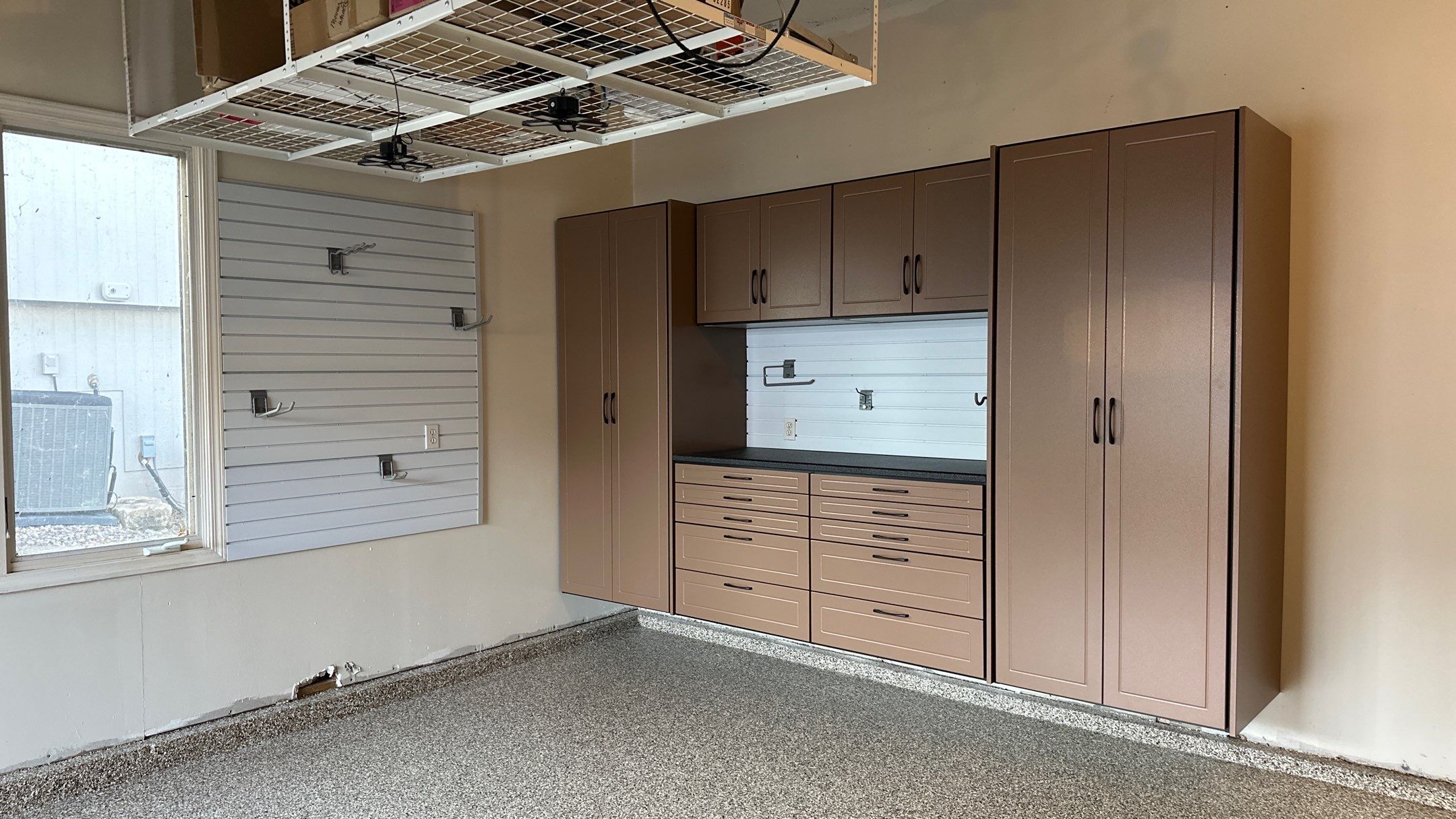 Jake P upgraded his garage with brand new cabinets and a new floor  by Banner Garage