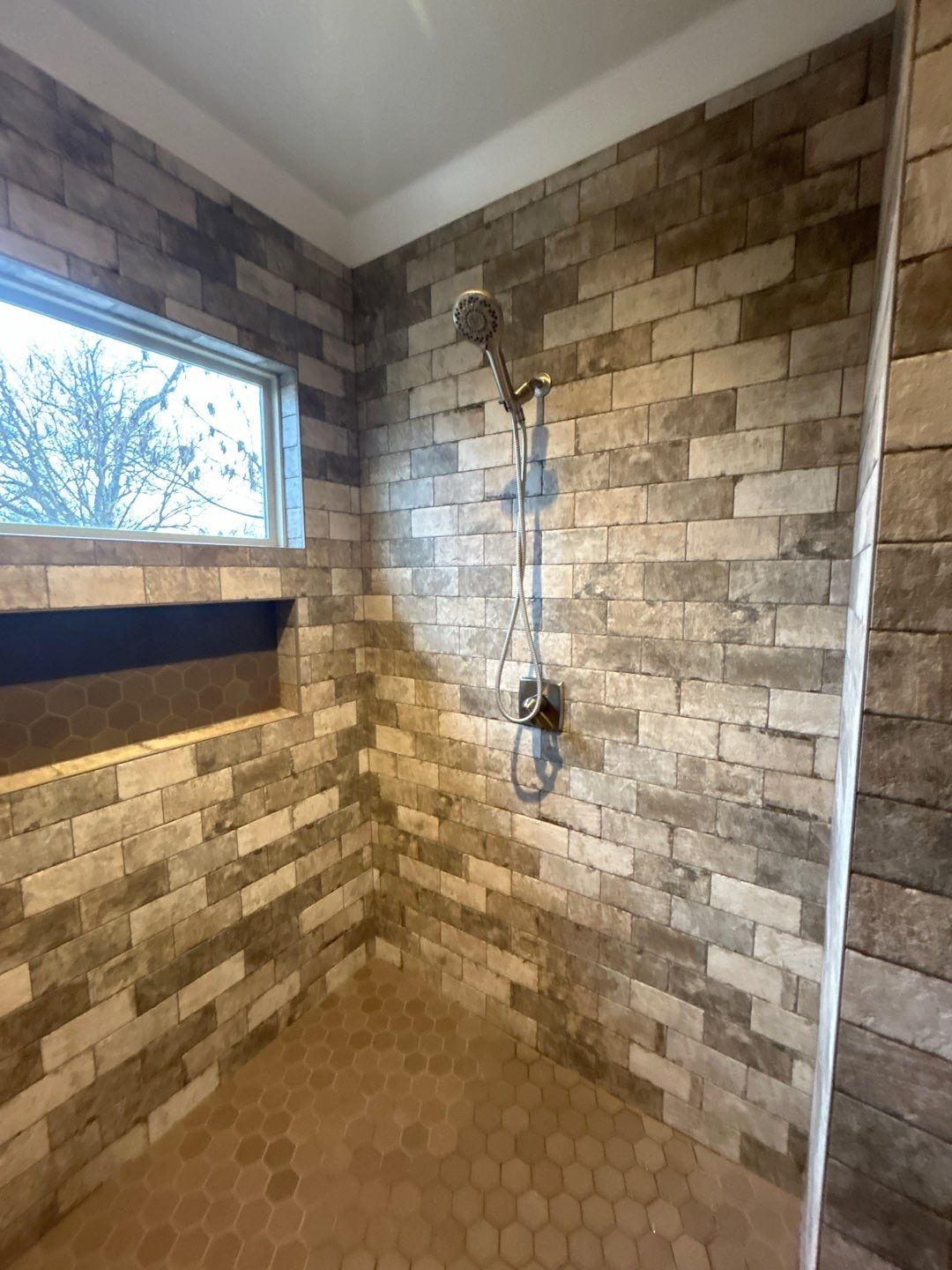 Shower upgrade by Footprints Floors of Nashville