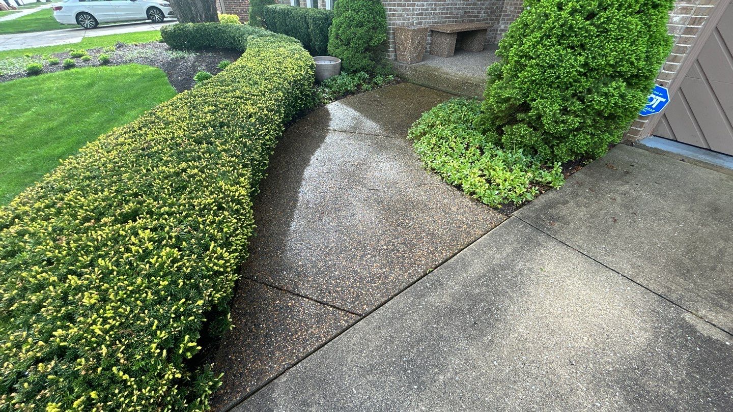 concrete patio and driveway cleaning by Northern Power Washing LLC.