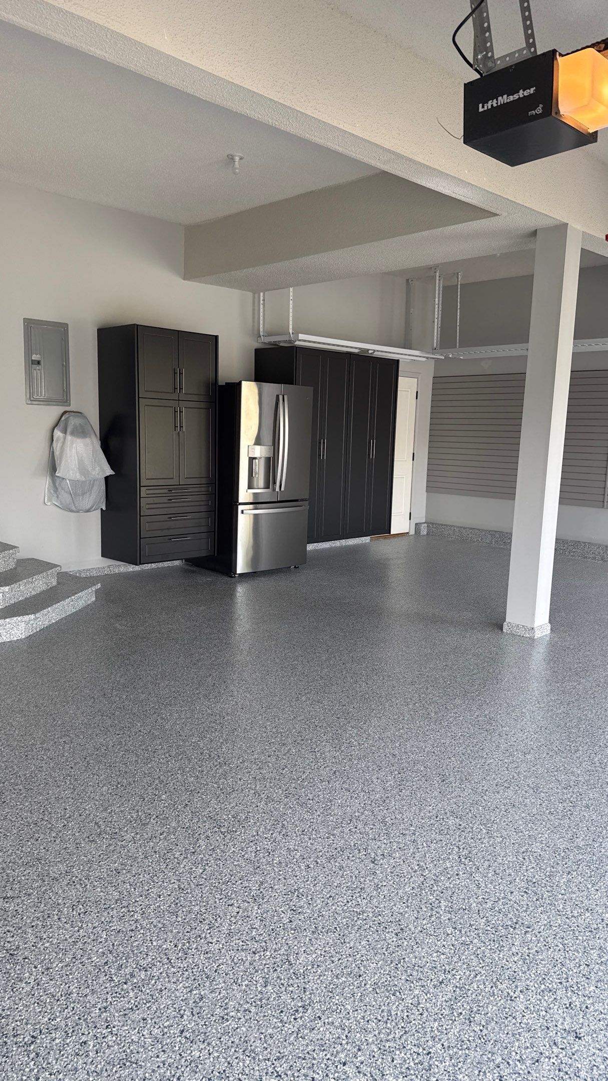Comprehensive Garage Renovation Featuring Epoxy Flooring and Custom Storage in Shawnee by Banner Garage