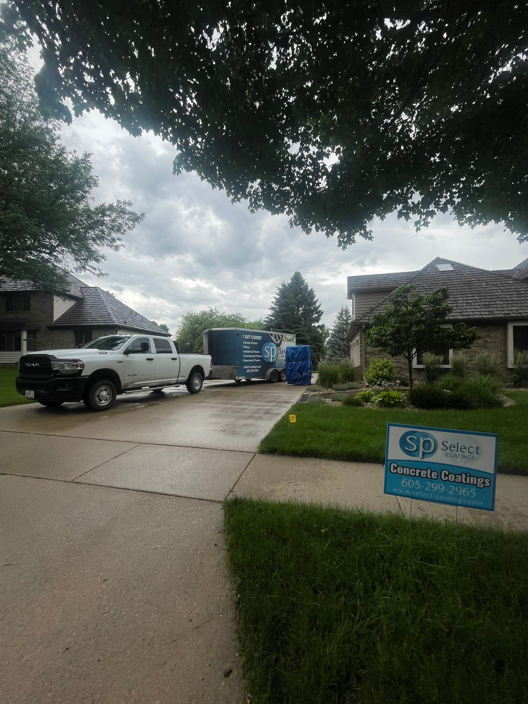 Gray Speckled Epoxy Garage Floor Coating in Sioux Falls by Select Painting, Coatings & Garage Cabinets