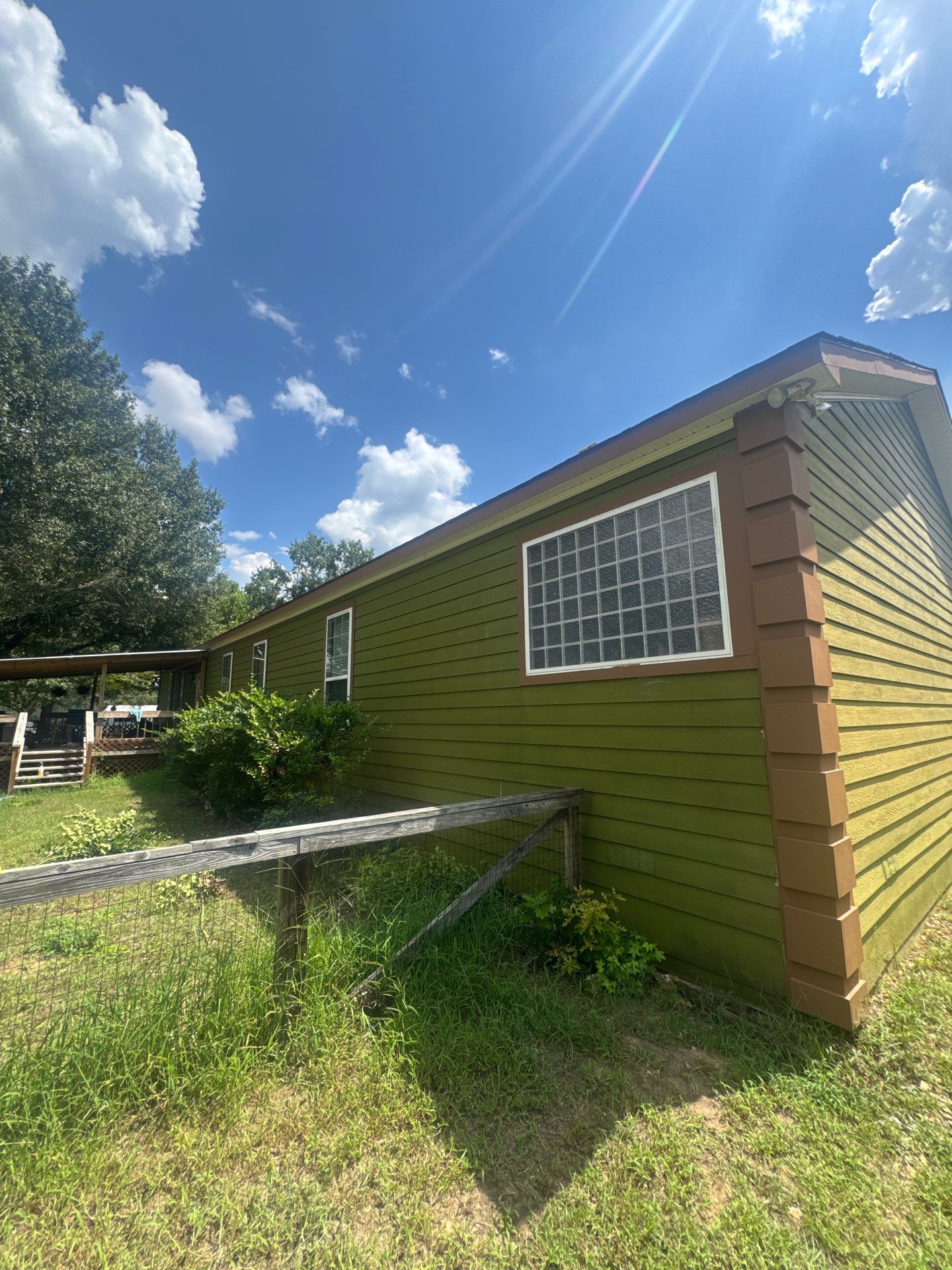 Exterior Painting in Lindale, TX | Bright Green Wood House Repaint by Quality Coats Painting
