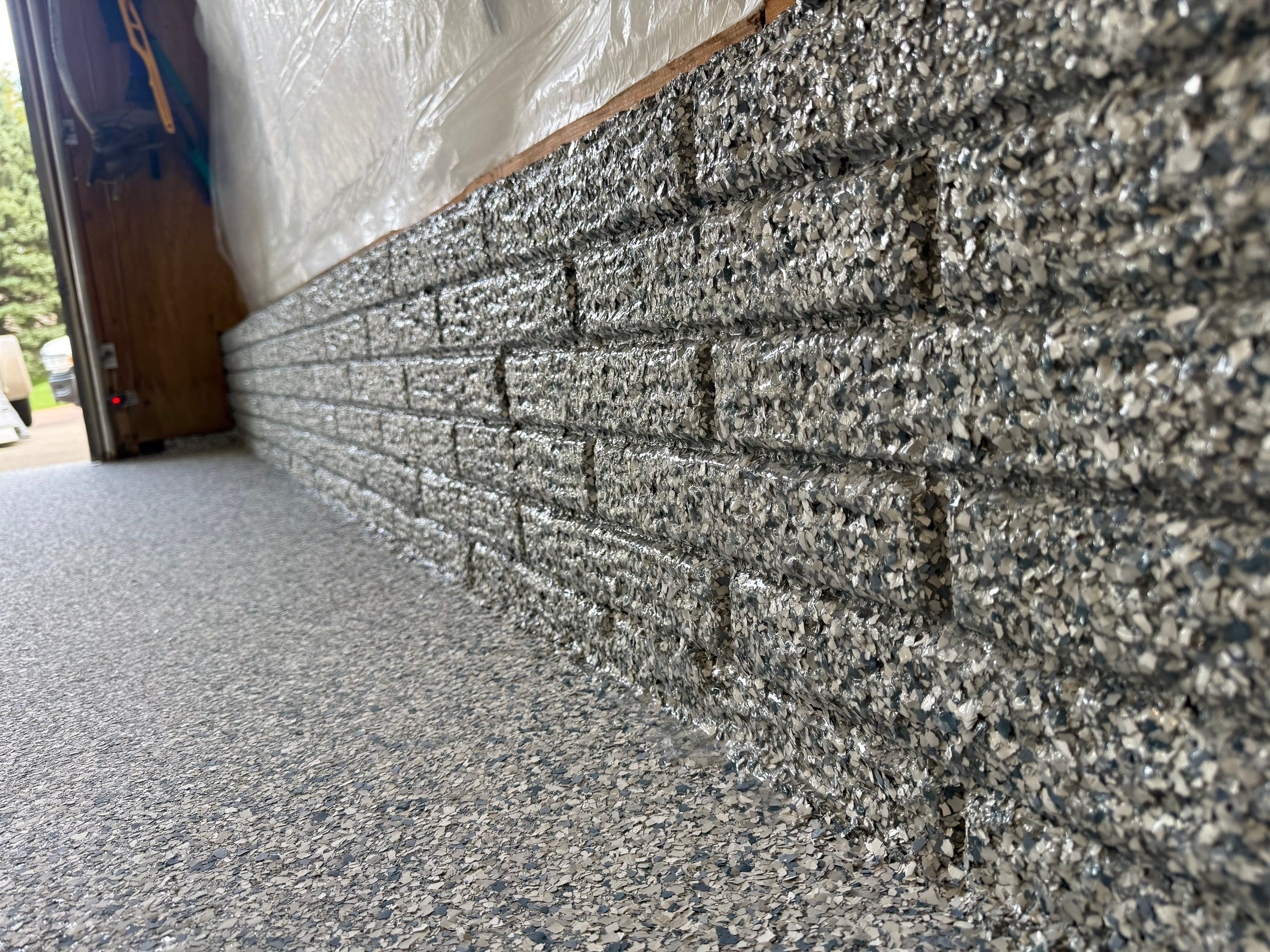 High-Performance Polyurea Garage Floor Coating and Stem Wall Finishing in Sioux Falls by Select Painting, Coatings & Garage Cabinets
