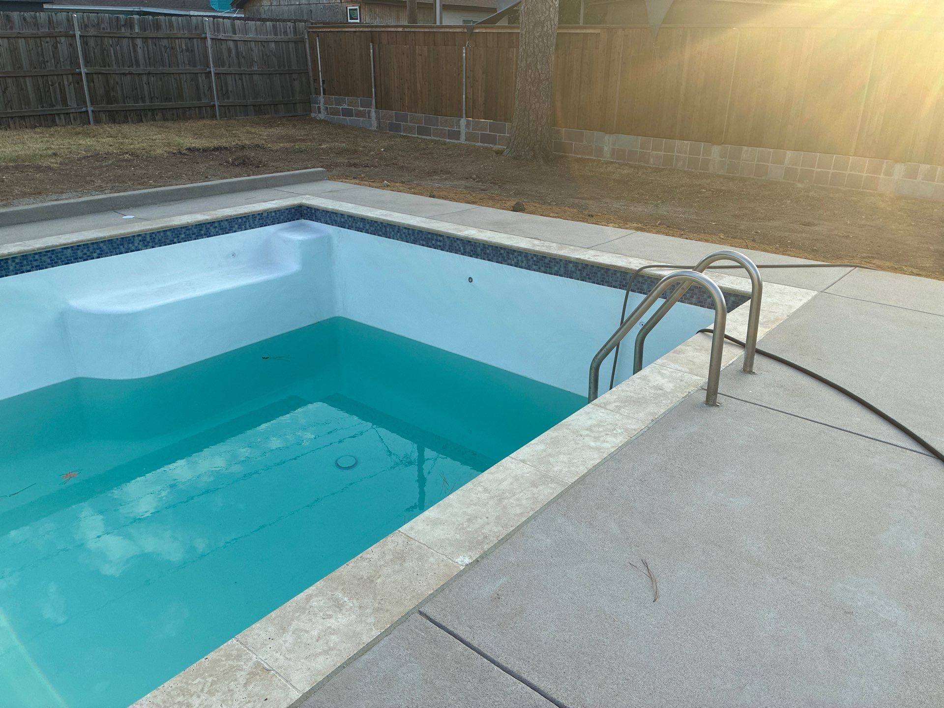Geometric Pool Remodel with New Plaster and Travertine Coping by Pinnacle Pools and Spas - DFW