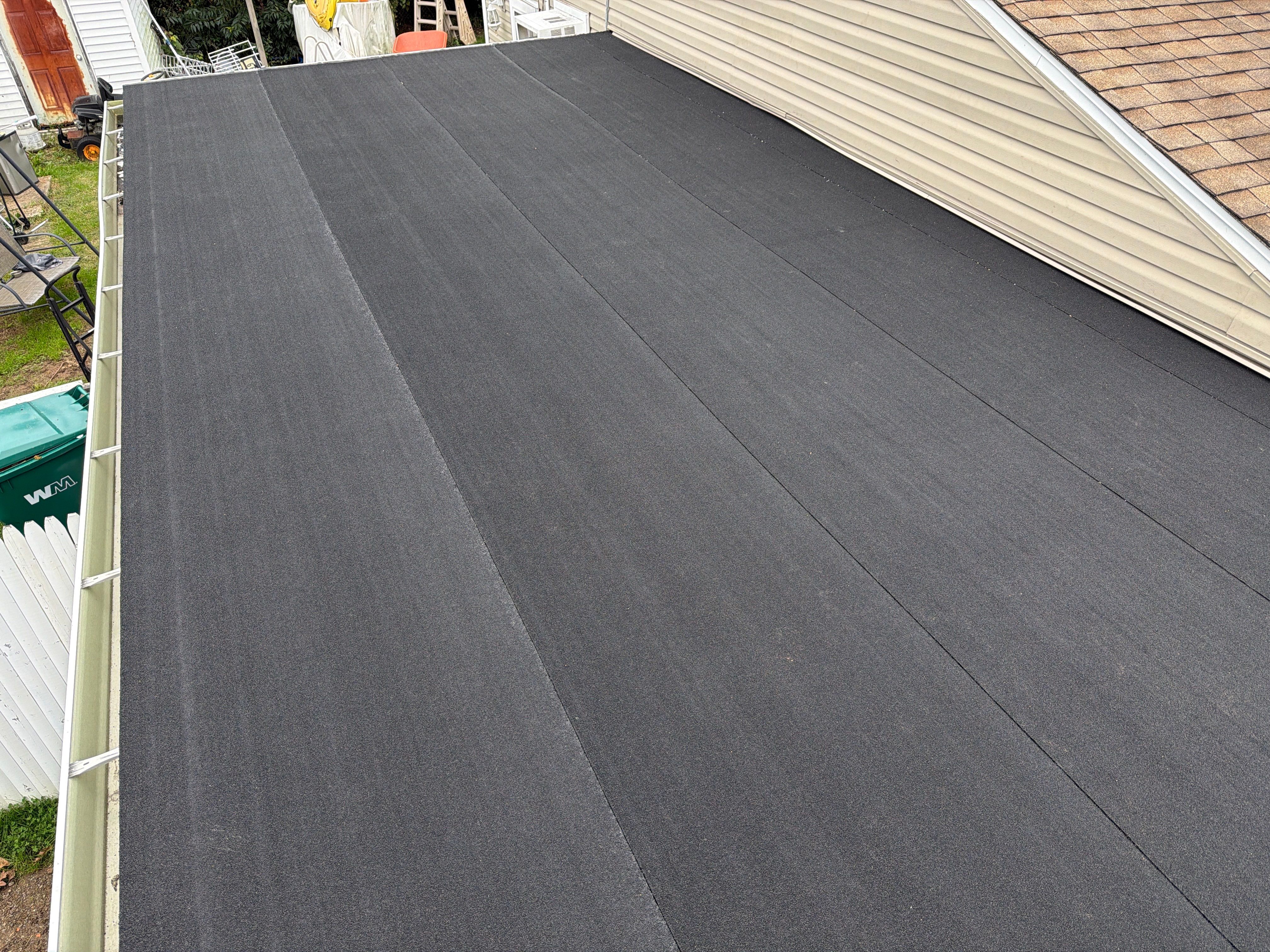 Flat Roof Replacement and Shingle Integration in Levittown by Stofan Construction LLC