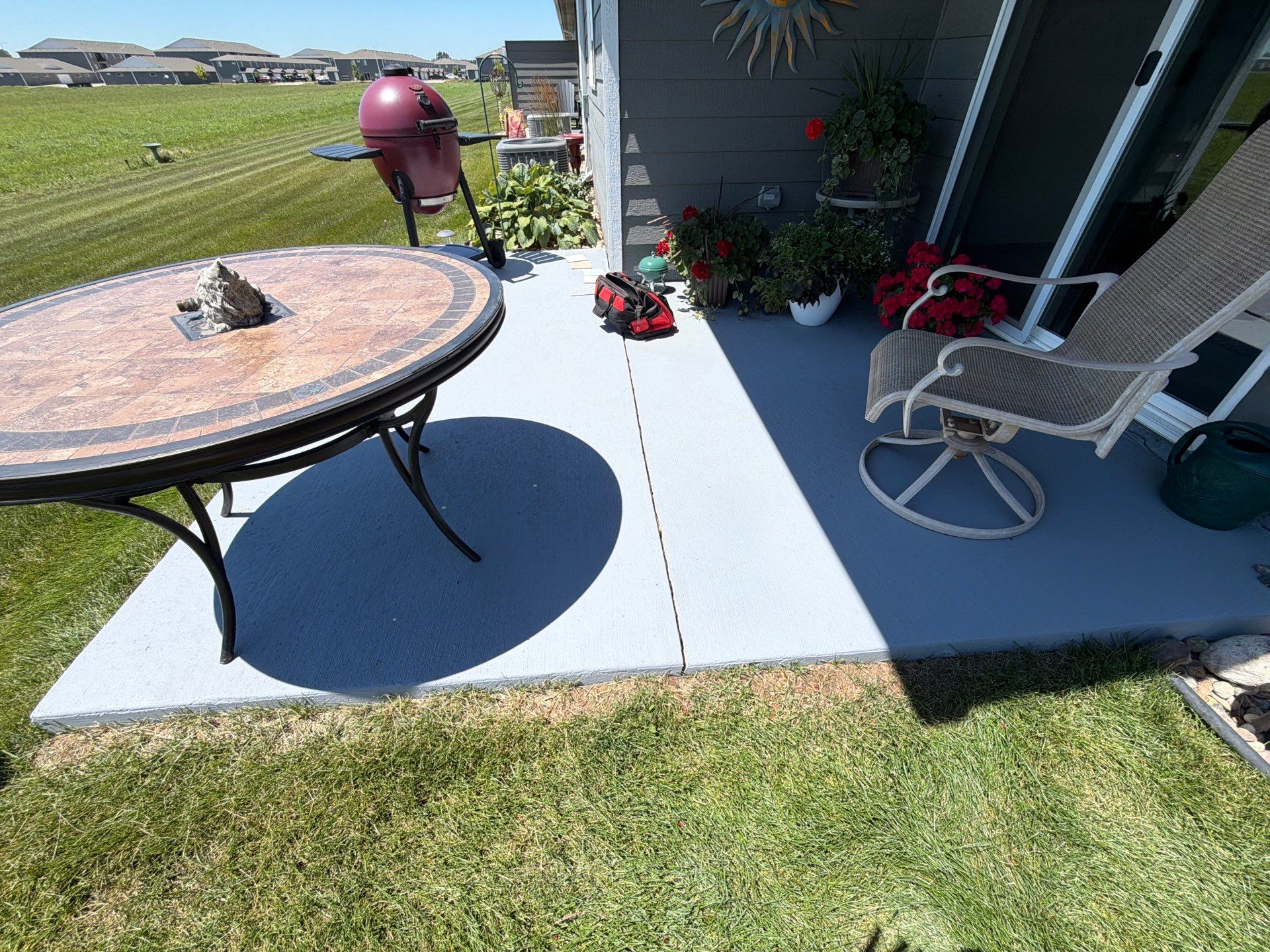 Starry Evening Concrete Patio Coating Installation in Tea by Select Painting, Coatings & Garage Cabinets