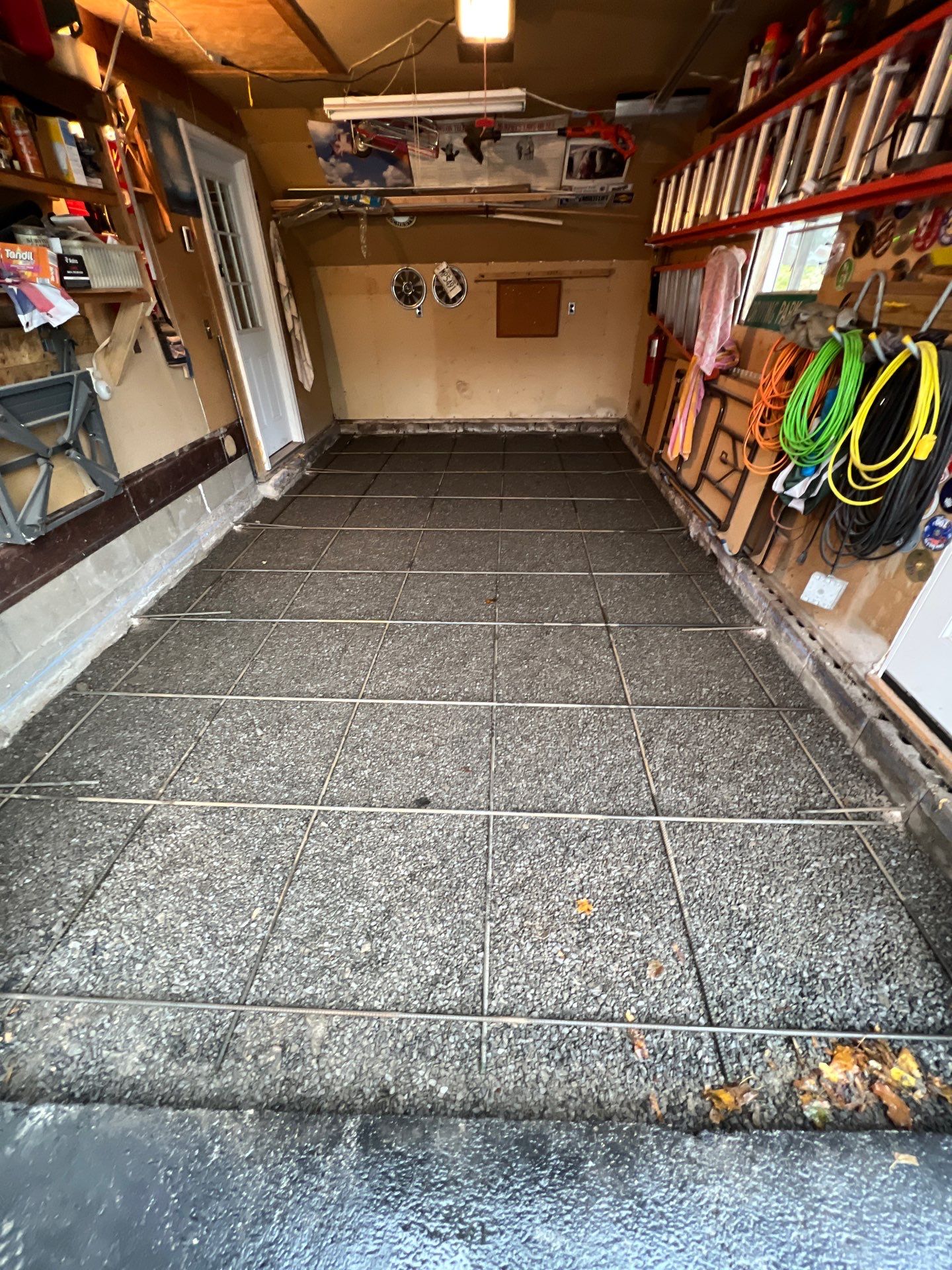 Concrete garage floor replacement   by NG Masonry & Construction LLC