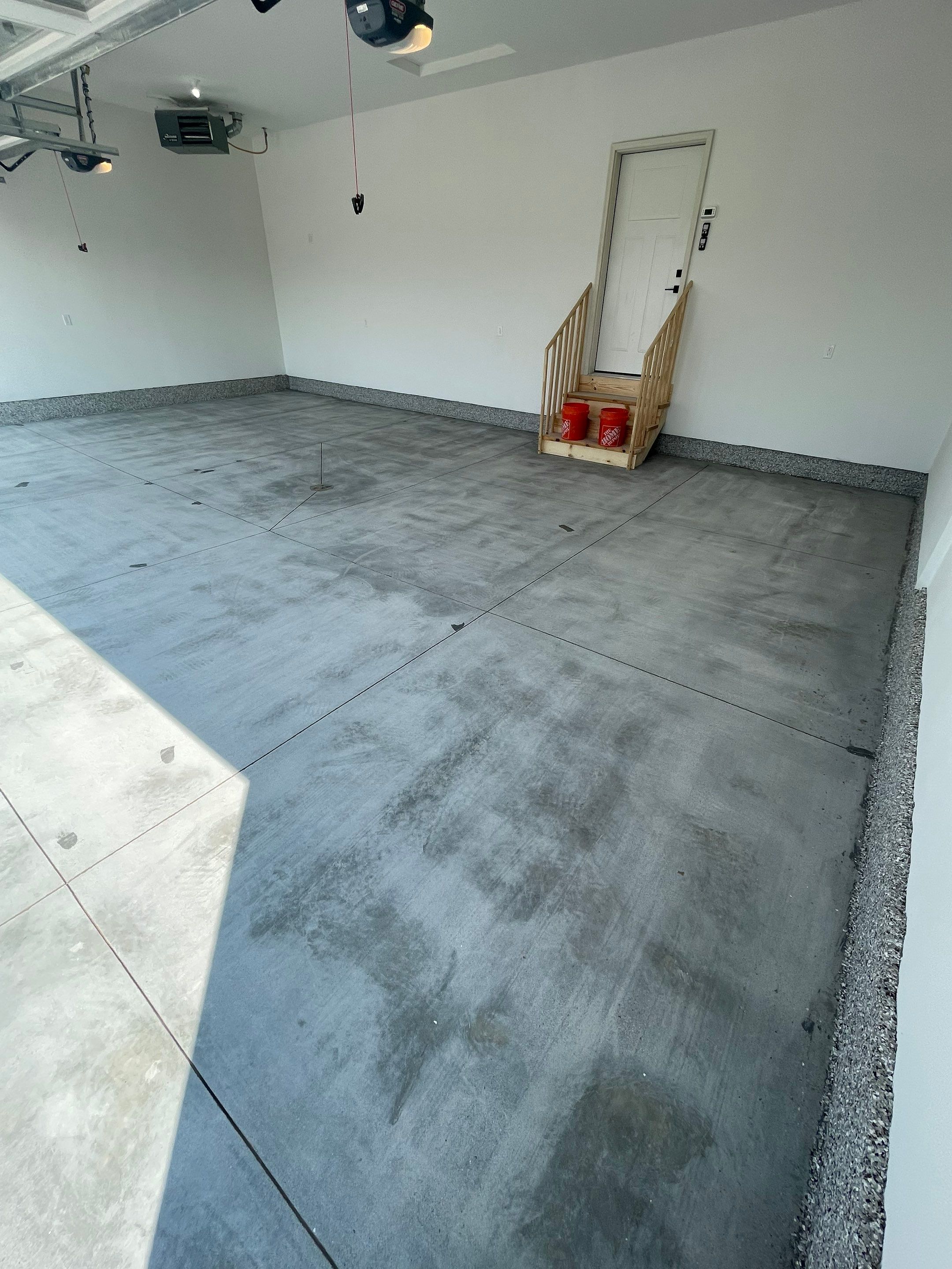 Grey Speckled Garage Floor Coating in Sioux Falls by Select Painting, Coatings & Garage Cabinets