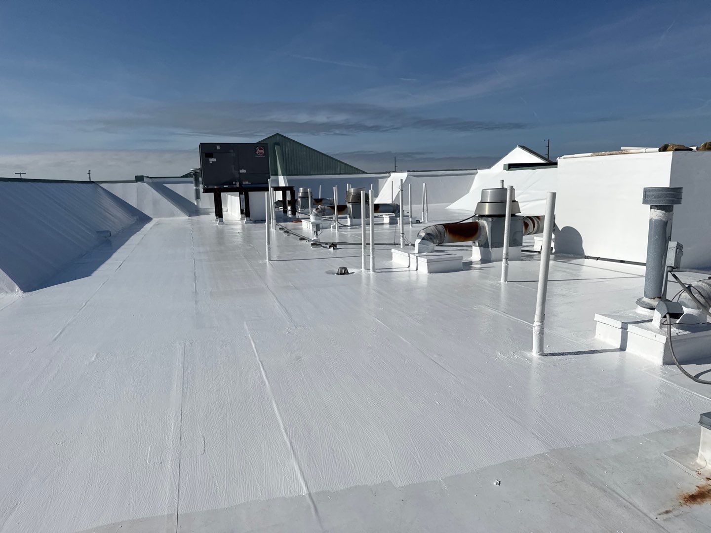 Commercial White Silicone Roof Coating for Hotel in Oldsmar by CES Roofing