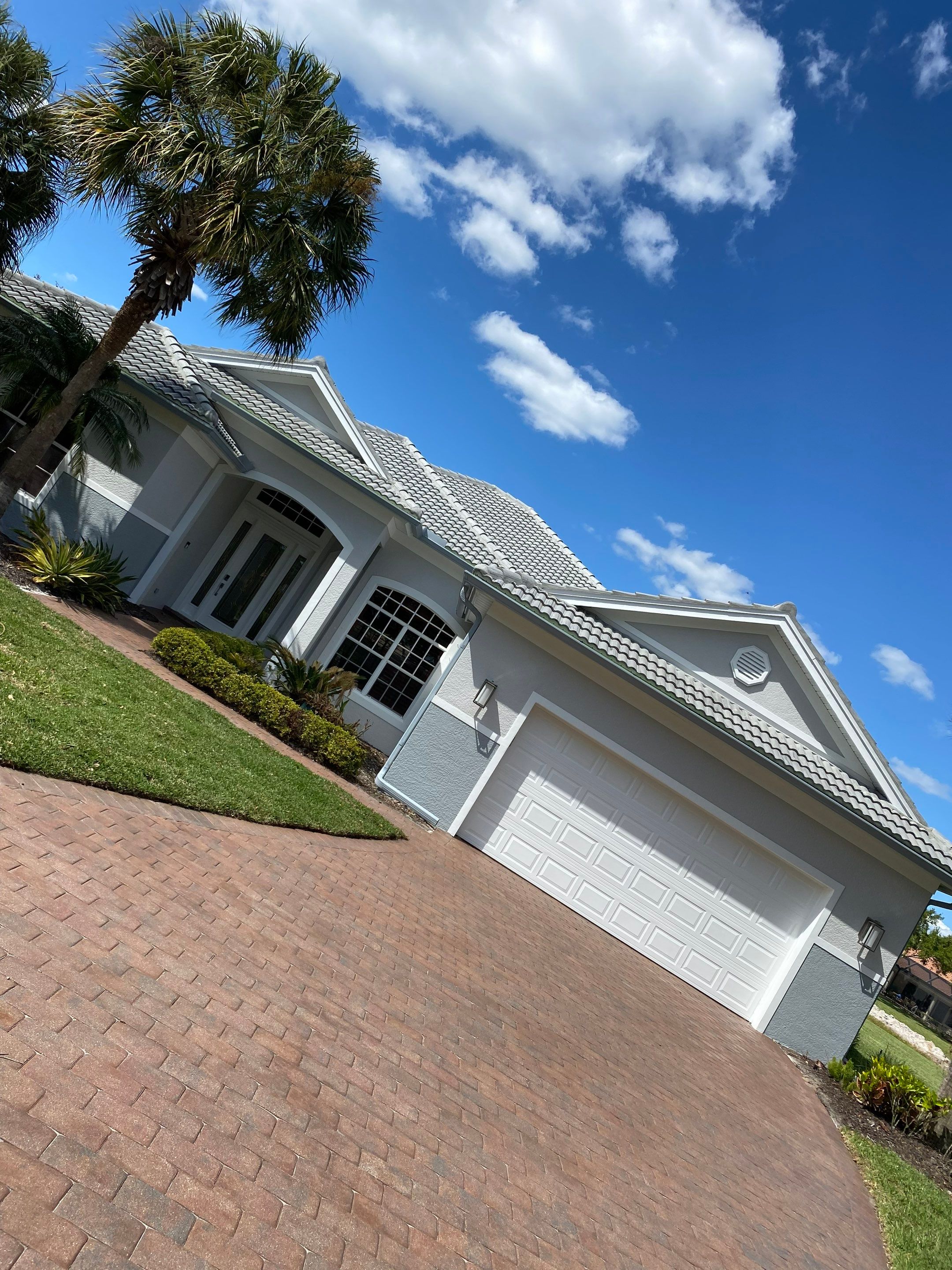 6-inch K-style Seamless Gutters and Splash Guard in Grey Color in Naples FL by Gutter Professors