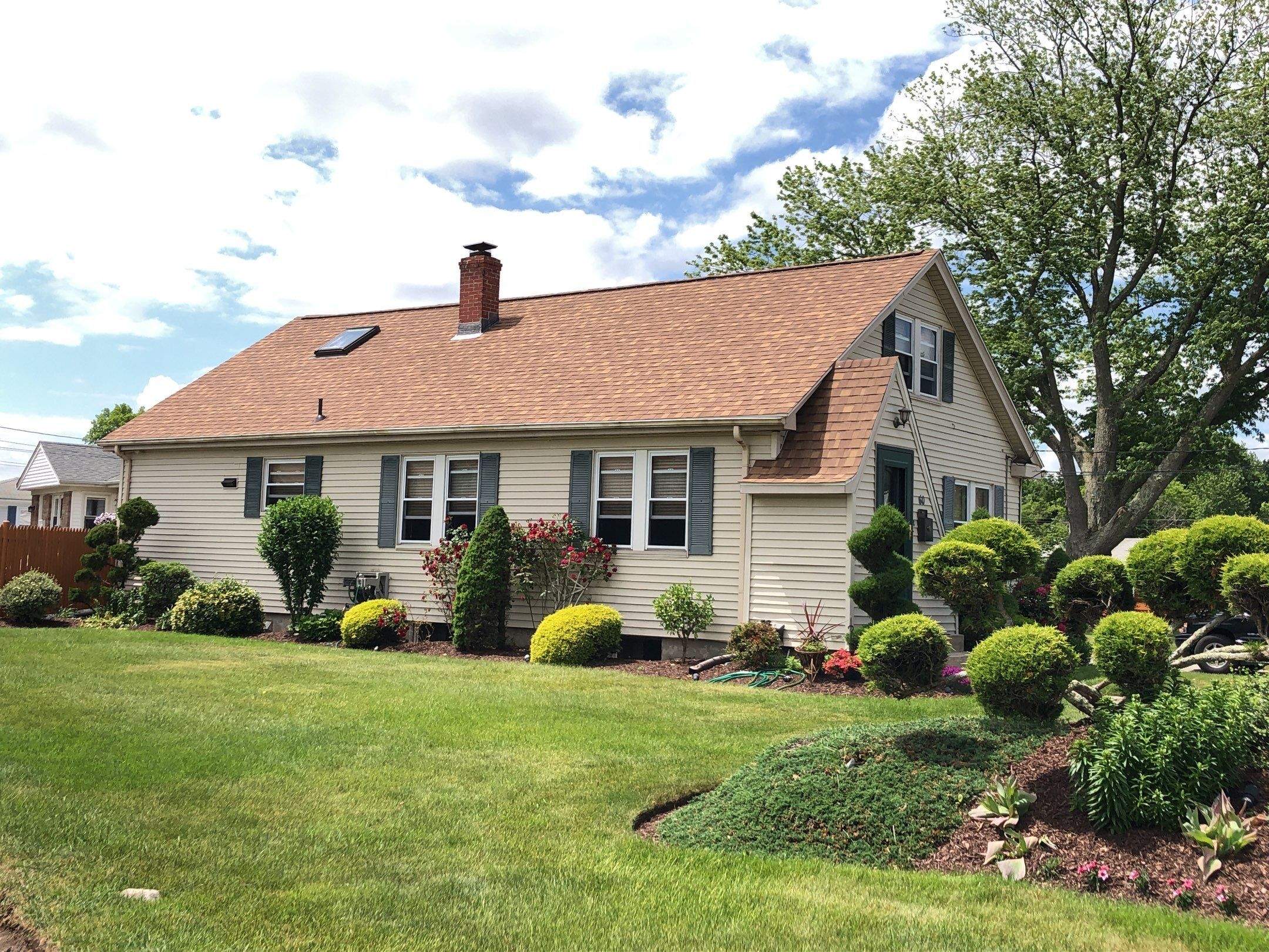 Burnt Sienna Roofs by Pinnacle Roofing & Skylights