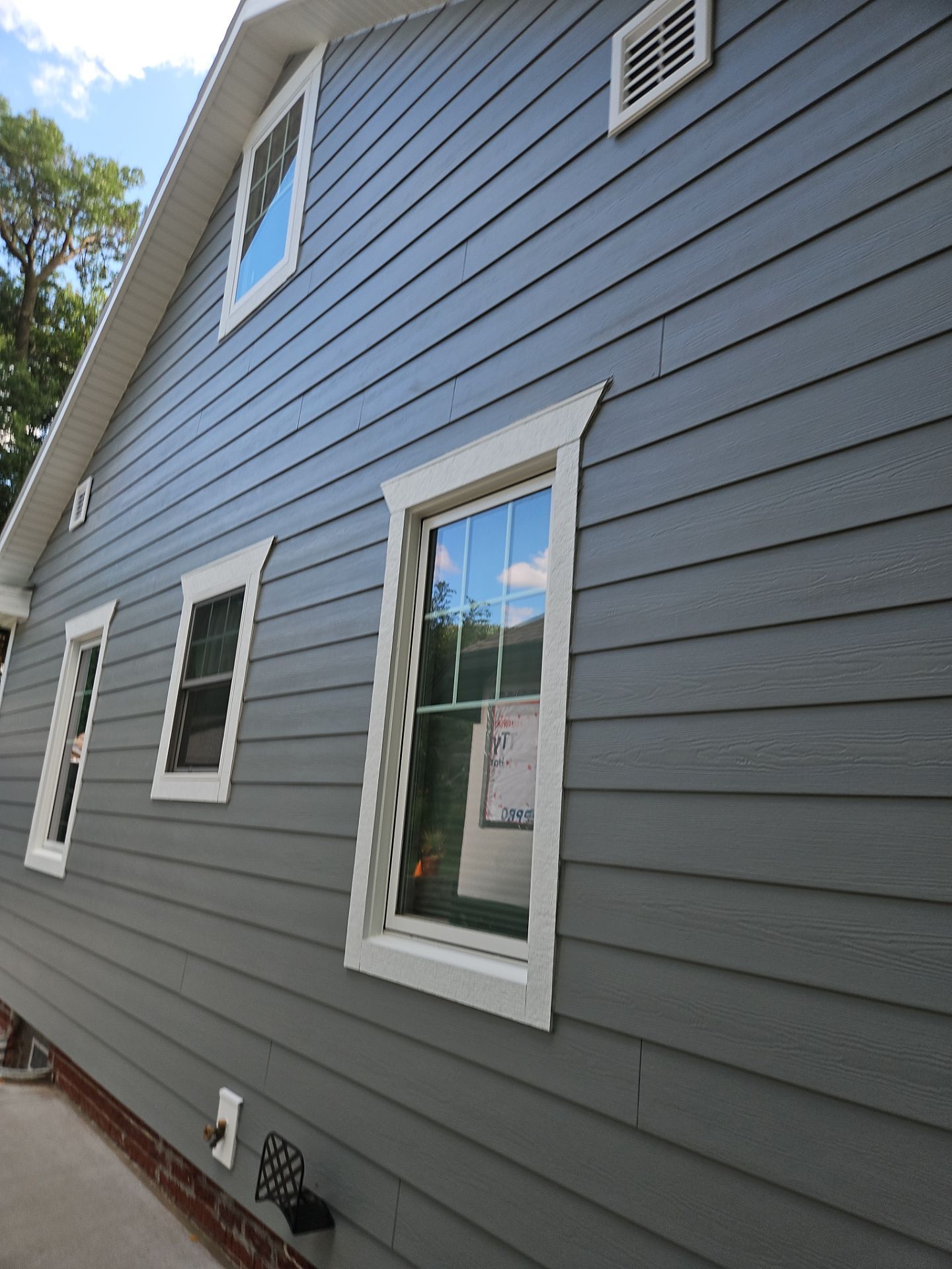 James Hardie Siding and Custom Window Trim Upgrade in Omaha by Carps Complete Exteriors