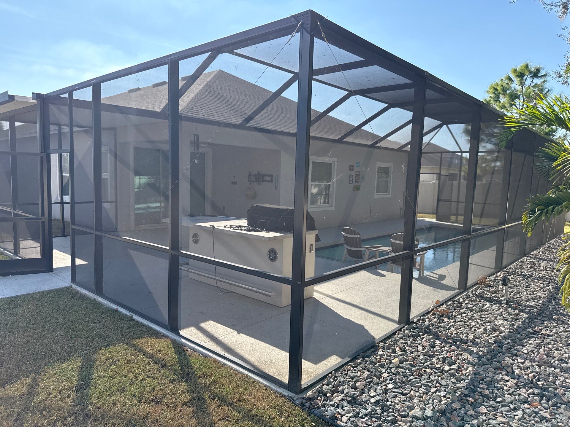 Painted Pool Deck & Screen Enclosure Cleaning | Heron Creek, Palmetto FL by Sunshine AquaWash