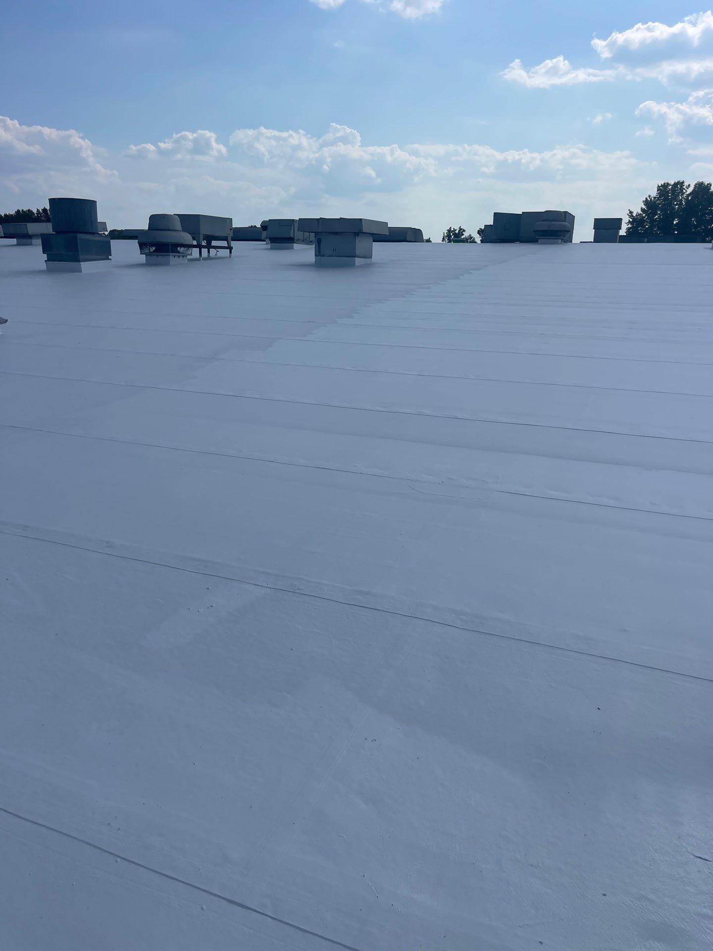 Commercial Roofing Installation using Coatings by Kentucky Commercial Roofing