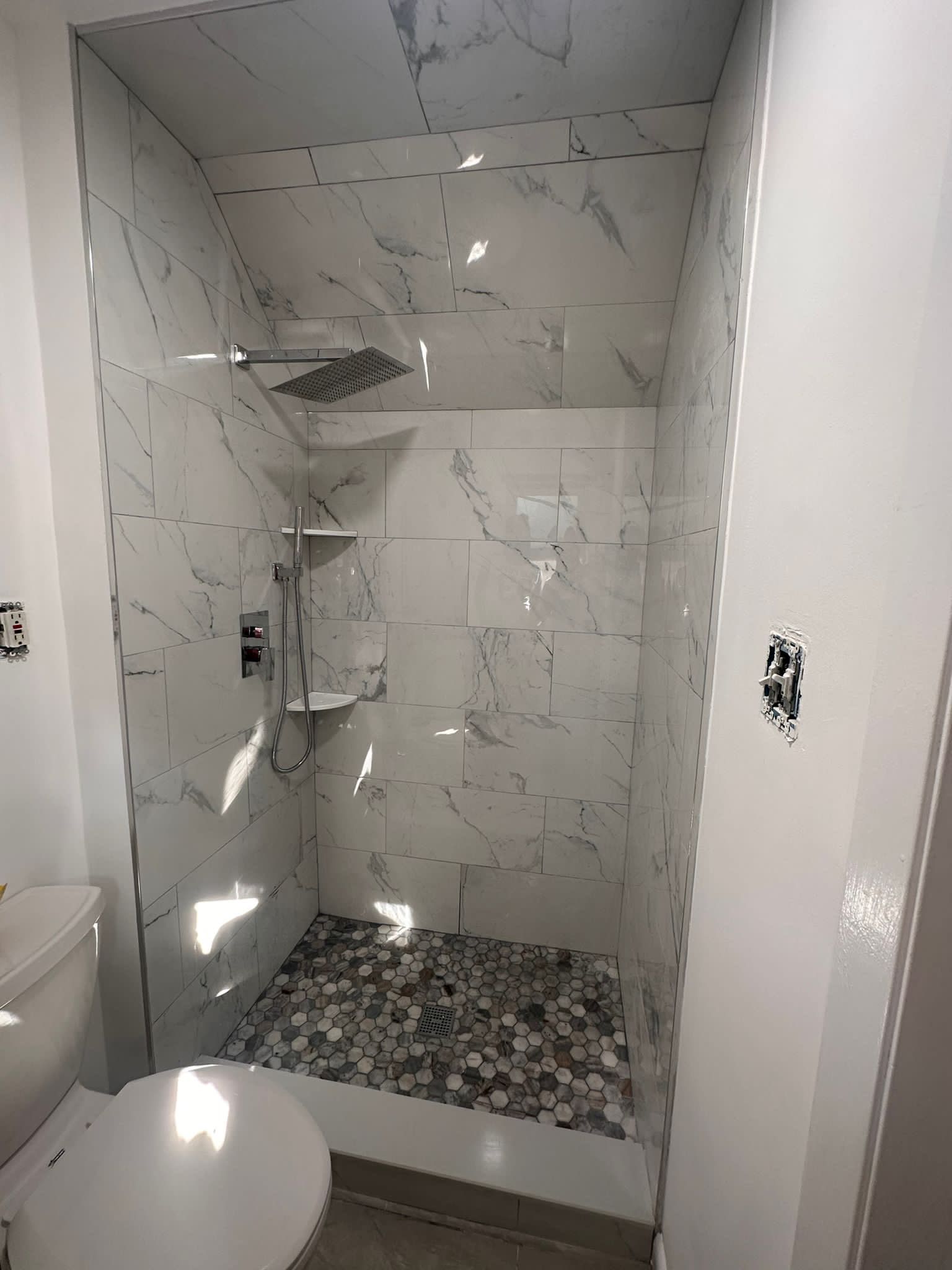 Bathroom Remodel using Tile by Home Concepts Construction