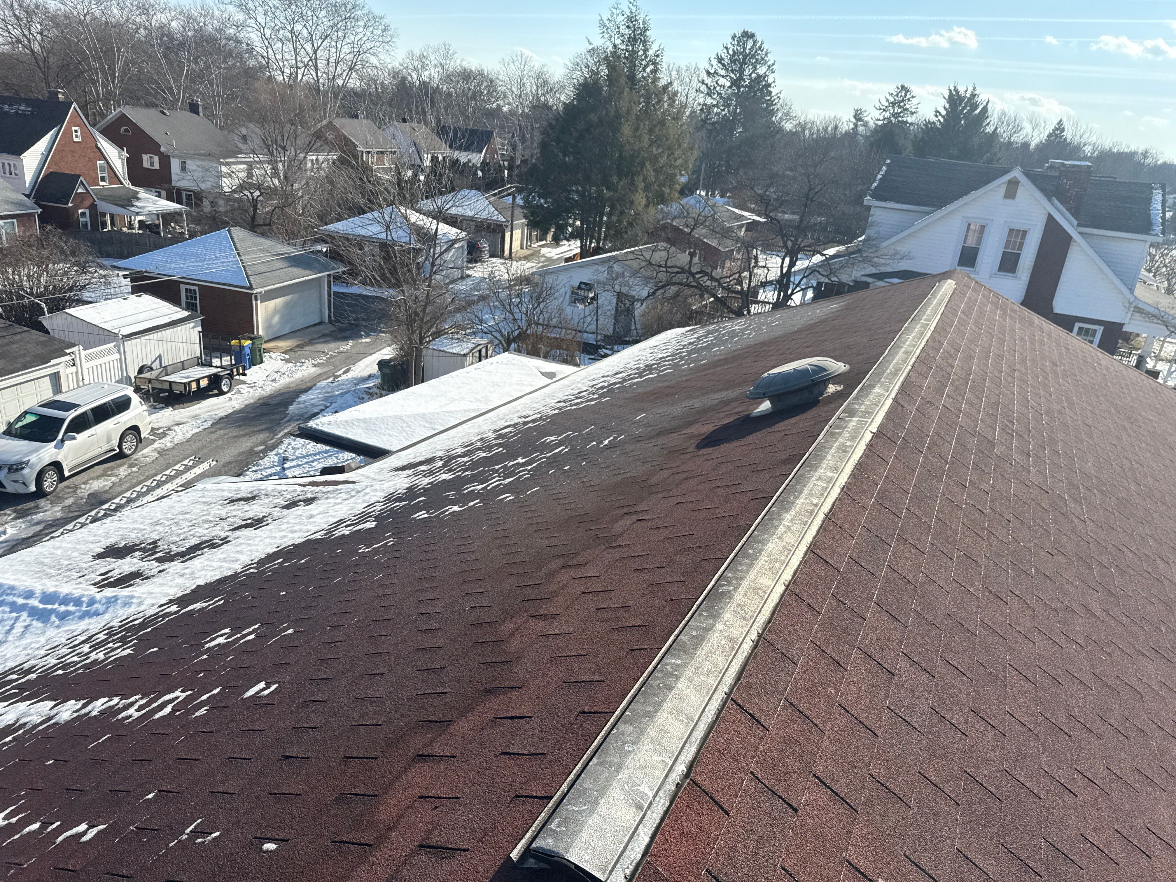 Red Metal Roofing Upgrade for Brick Home by Esh Builders