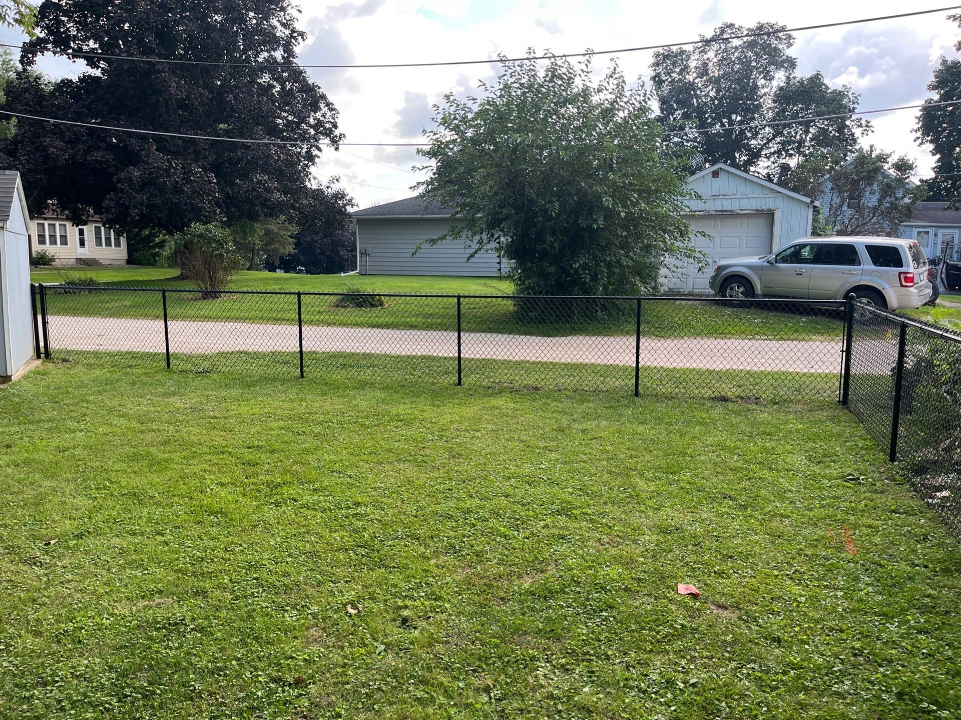 Black Chain Link Perimeter Fence and Gate Installation in Shell Rock by Perfect Picket Fence and Stain