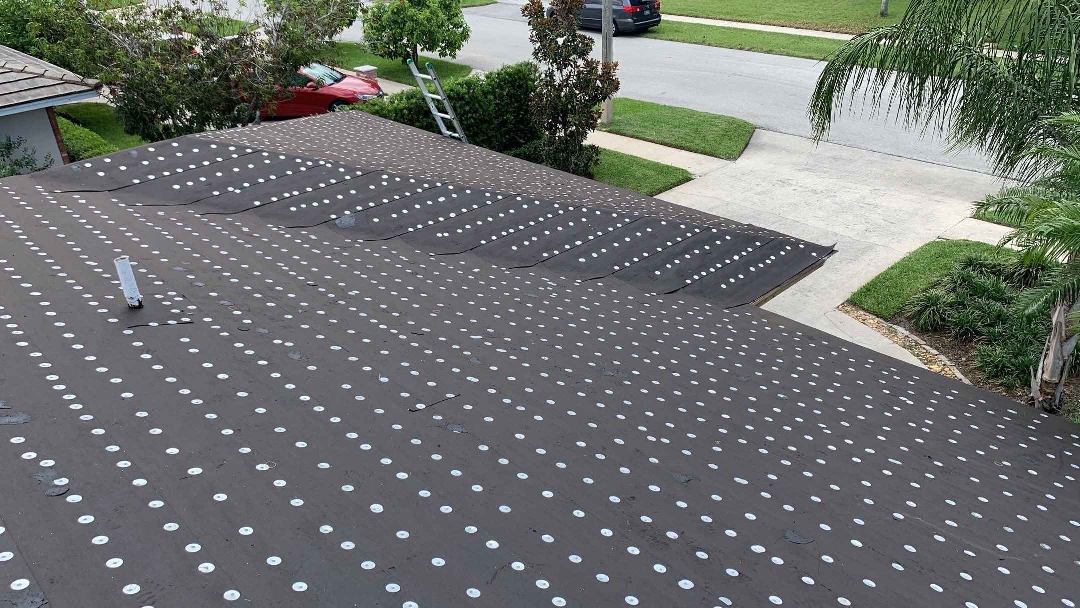 Residential Roofing Installation using 1" Nail strip metal roof by BLUES BROTHERS ROOFING