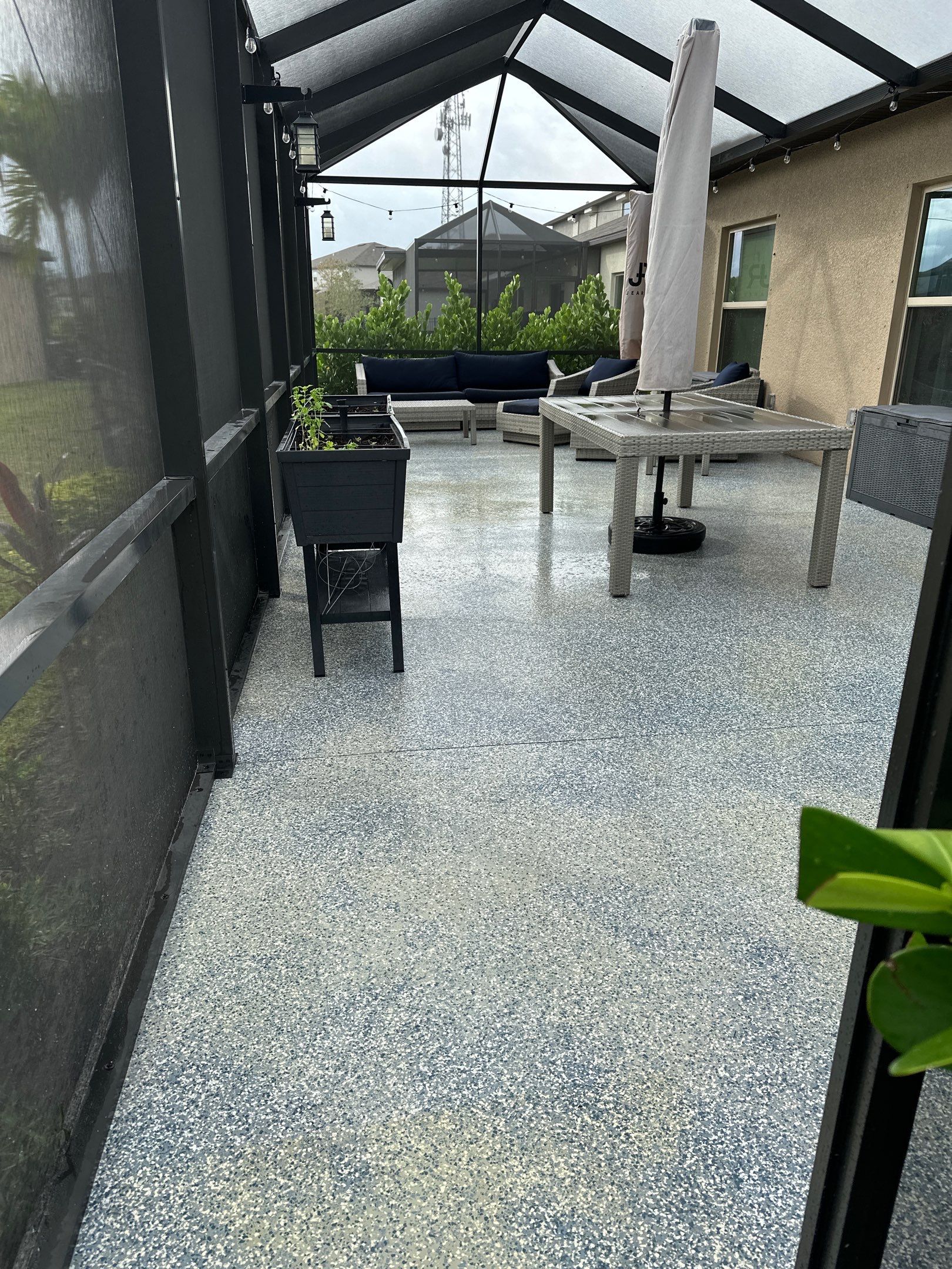 Lanai & Patio Cleaning with Epoxy-Coated Concrete Floor in Trevesta Community, Palmetto, FL | Sunshine AquaWash by Sunshine AquaWash