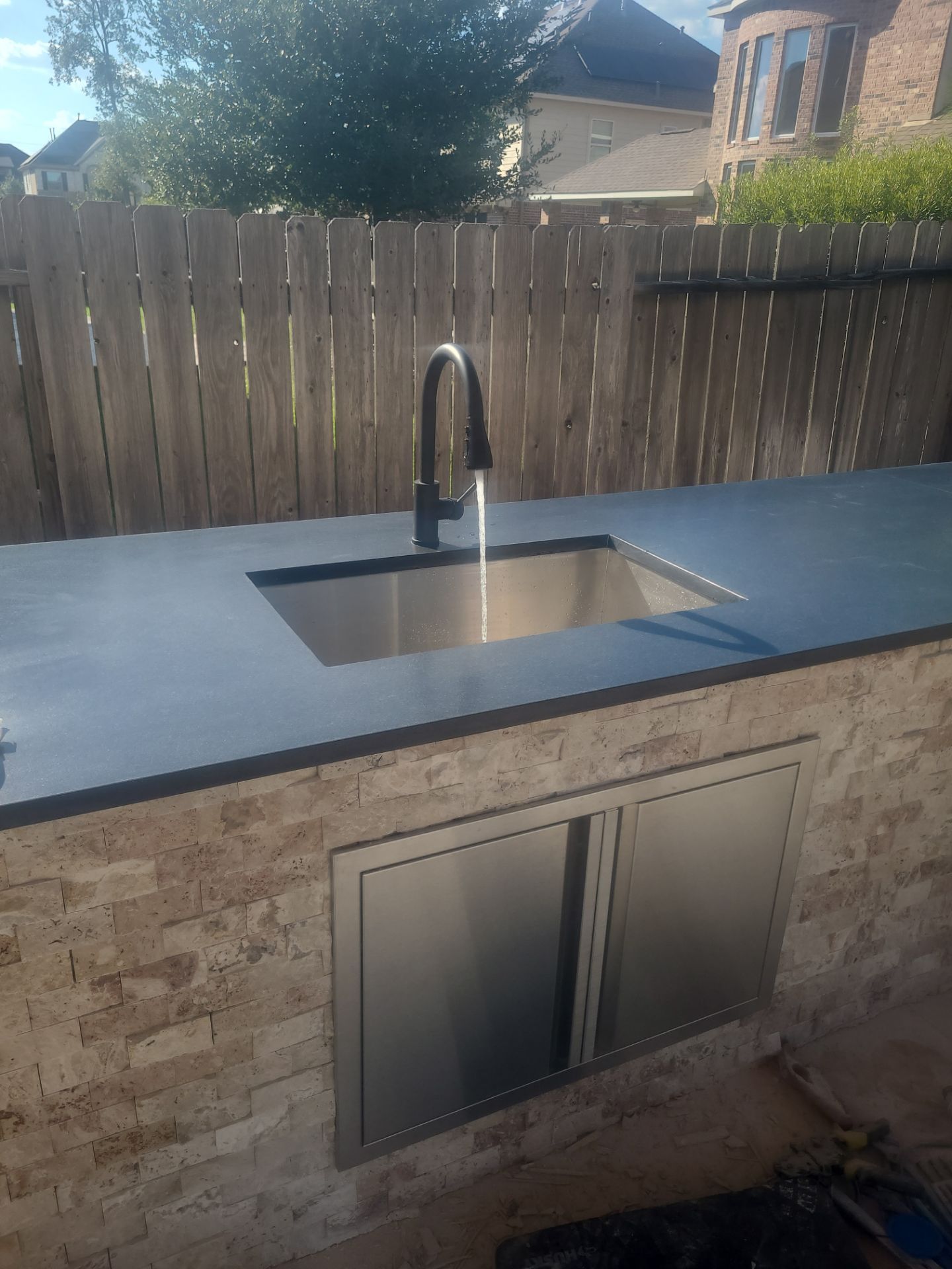 Covered Patio and Summer Kitchen in Spring,  TX by SophAlx LLC