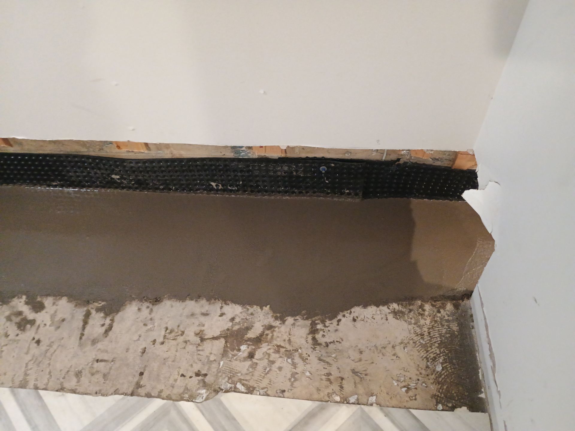 Interior Drain Tile & Buried Discharge in St. Anthony, MN by Waterproofing Northeast