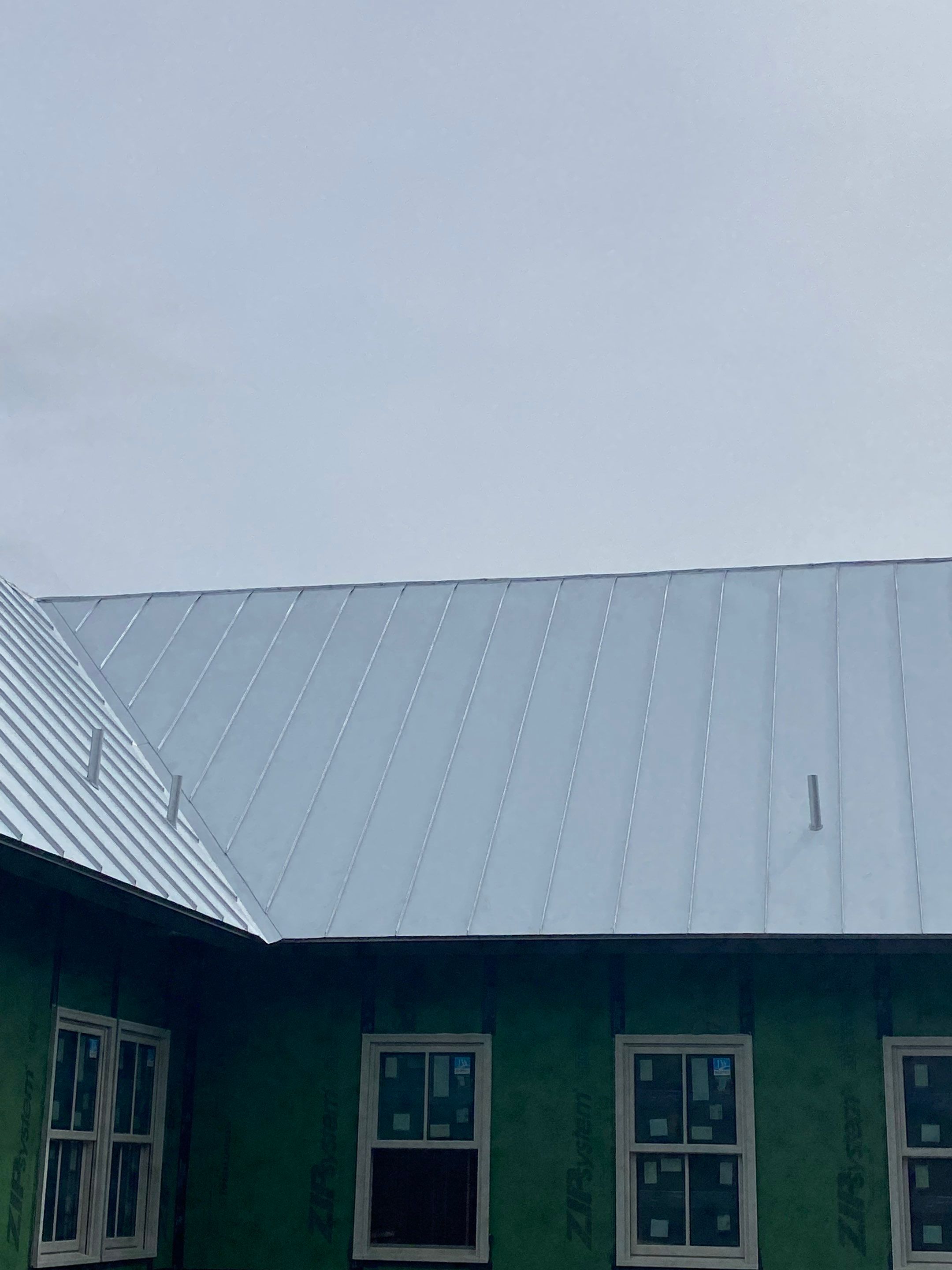 Residential Metal Roof Installation using McElroy Metal by Premier Roofing and Contracting