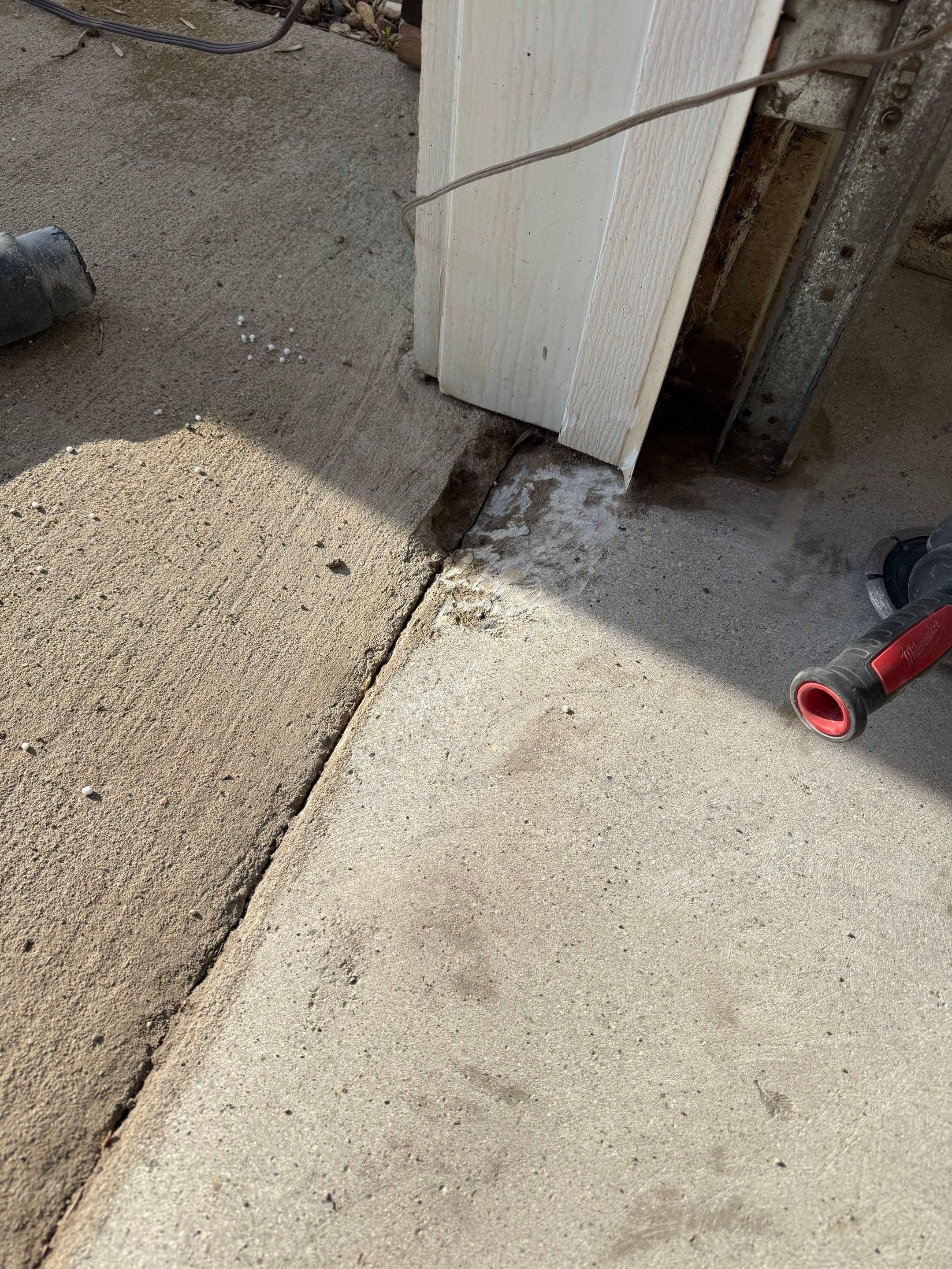 Feather Grey Garage Floor Coating and Crack Repair in Beresford by Select Painting, Coatings & Garage Cabinets