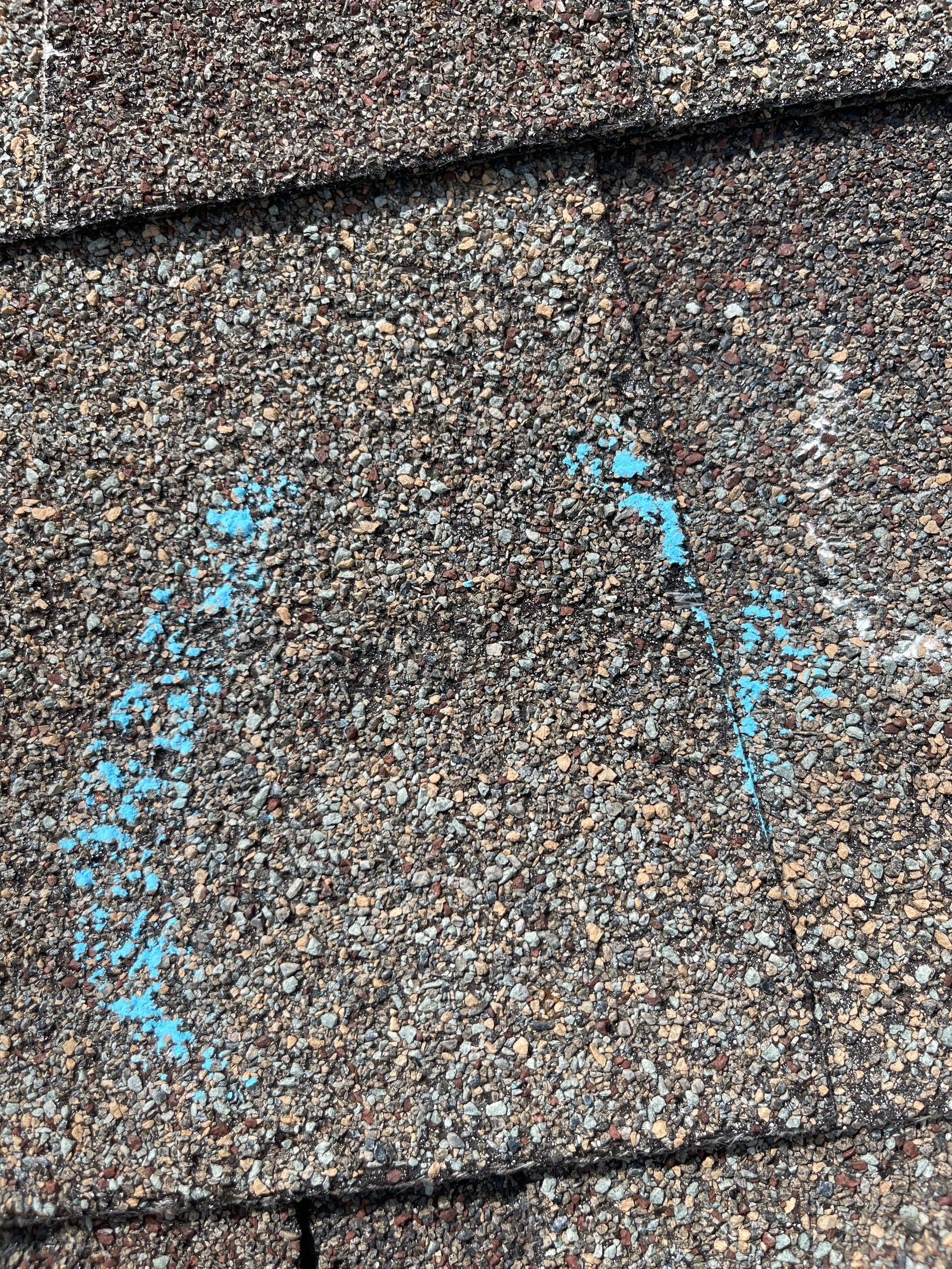 Hail Damage on a Roofing System by Icon Roofing And Construction 
