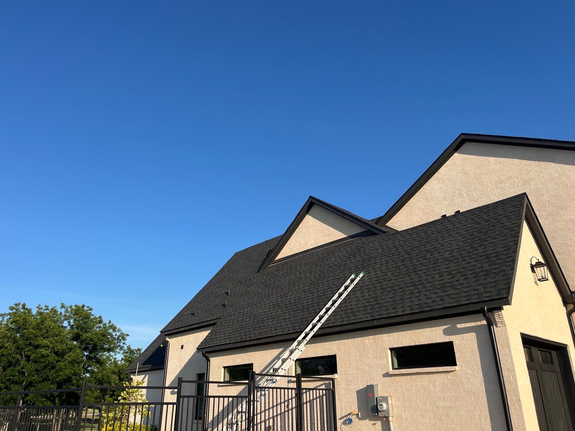 GAF-Charcoal with White Brick  by Tejas Roofworks + Restoration