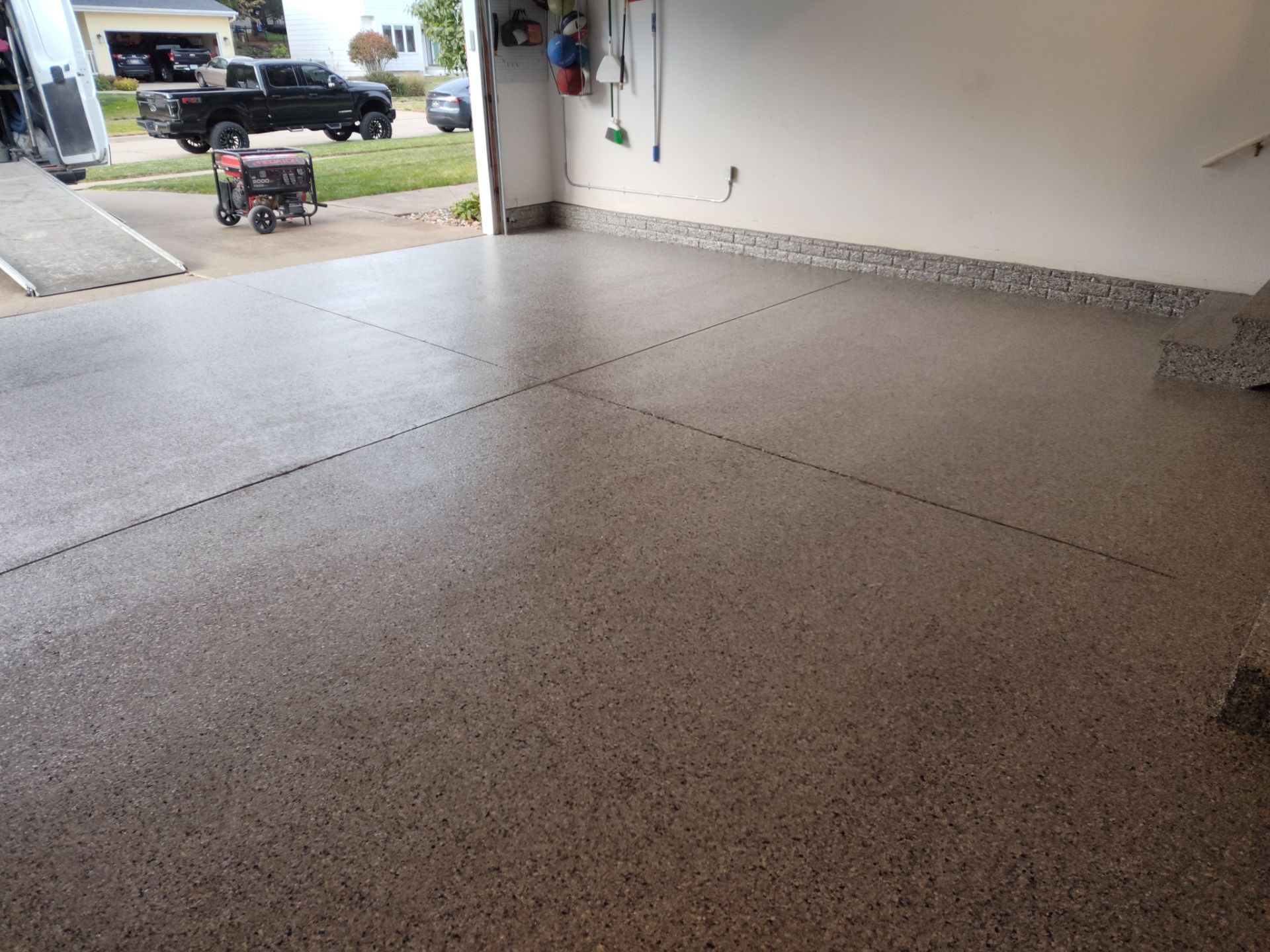 A Garage In One Day Keeps the Rock Salt Away! by Revival Concrete Coatings, LLC